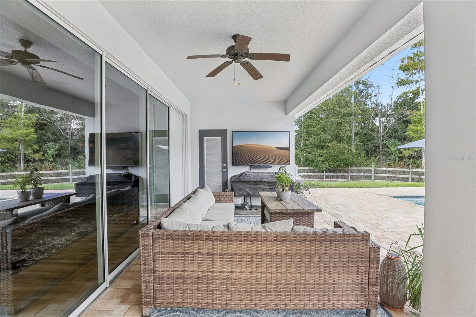 A COVERED PORCH AND EXTENDED PATIO with brick pavers provides plenty of space for outdoor dining, lounging and entertaining. - 19179 SABAL ST, ORLANDO