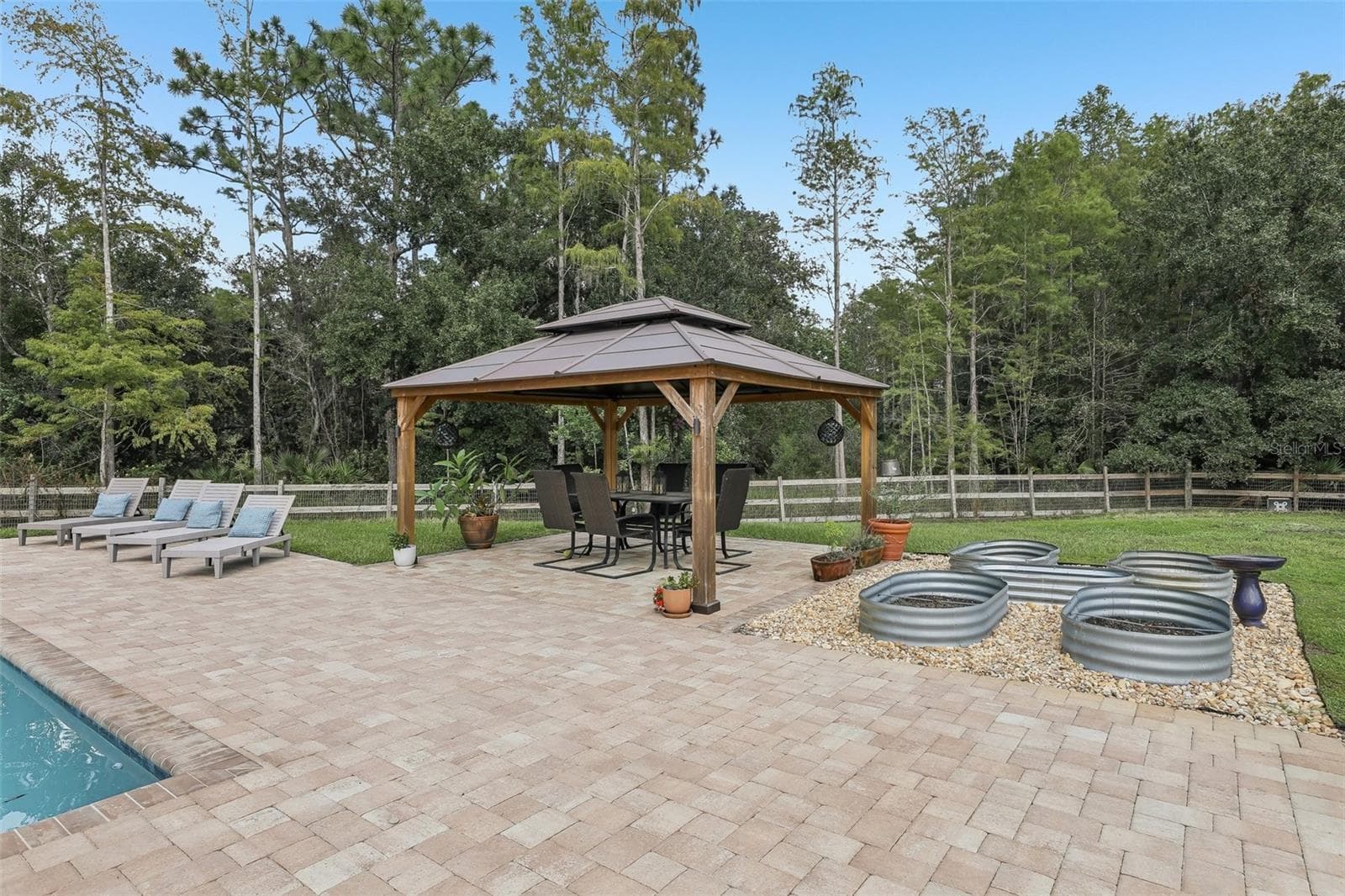 A charming GAZEBO and small garden area add to the appeal. - 19179 SABAL ST, ORLANDO