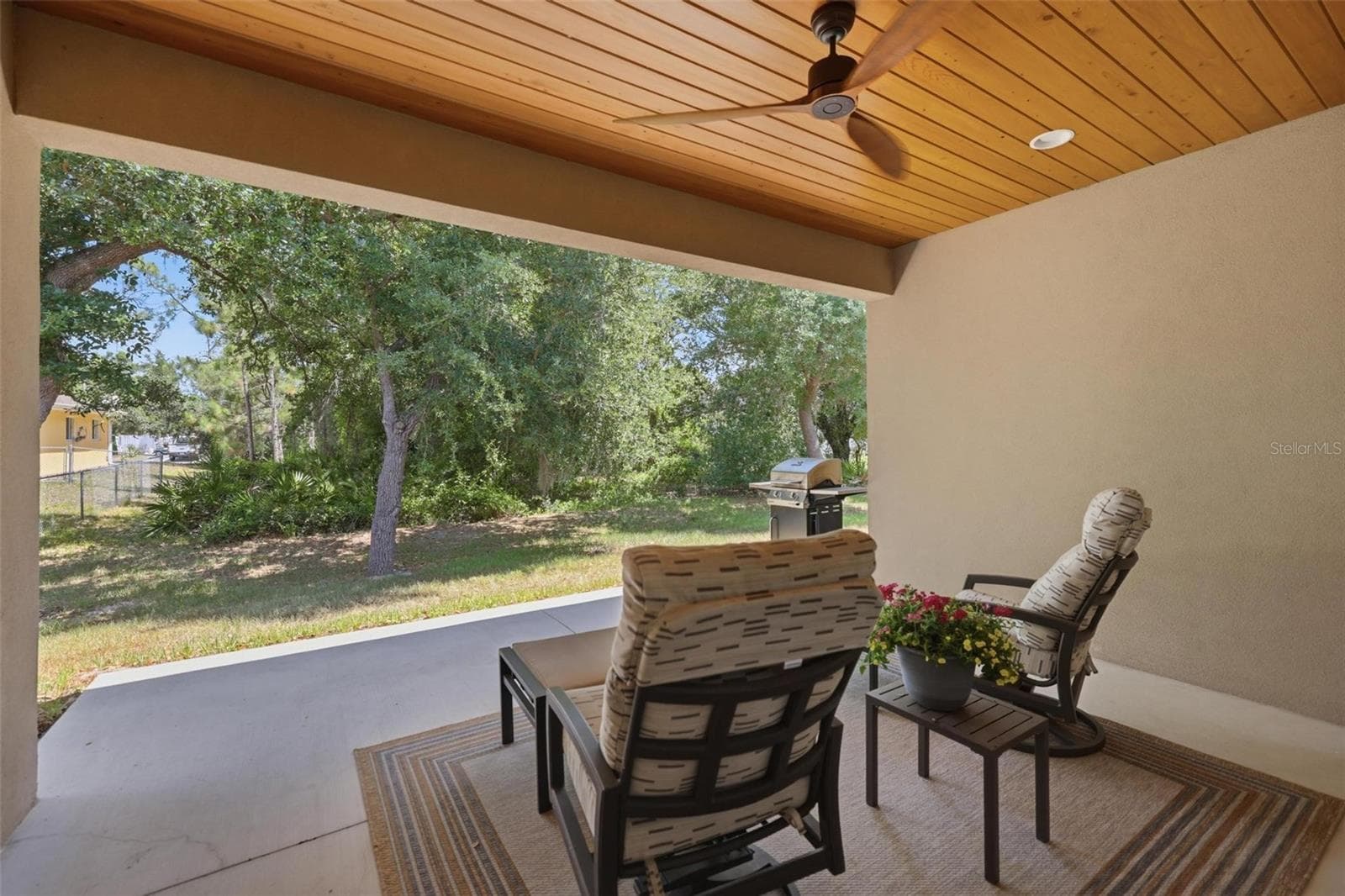 Patio/lanai sitting area with custom cypress ceiling - 6172 ALHAMBRA AVE, NORTH PORT