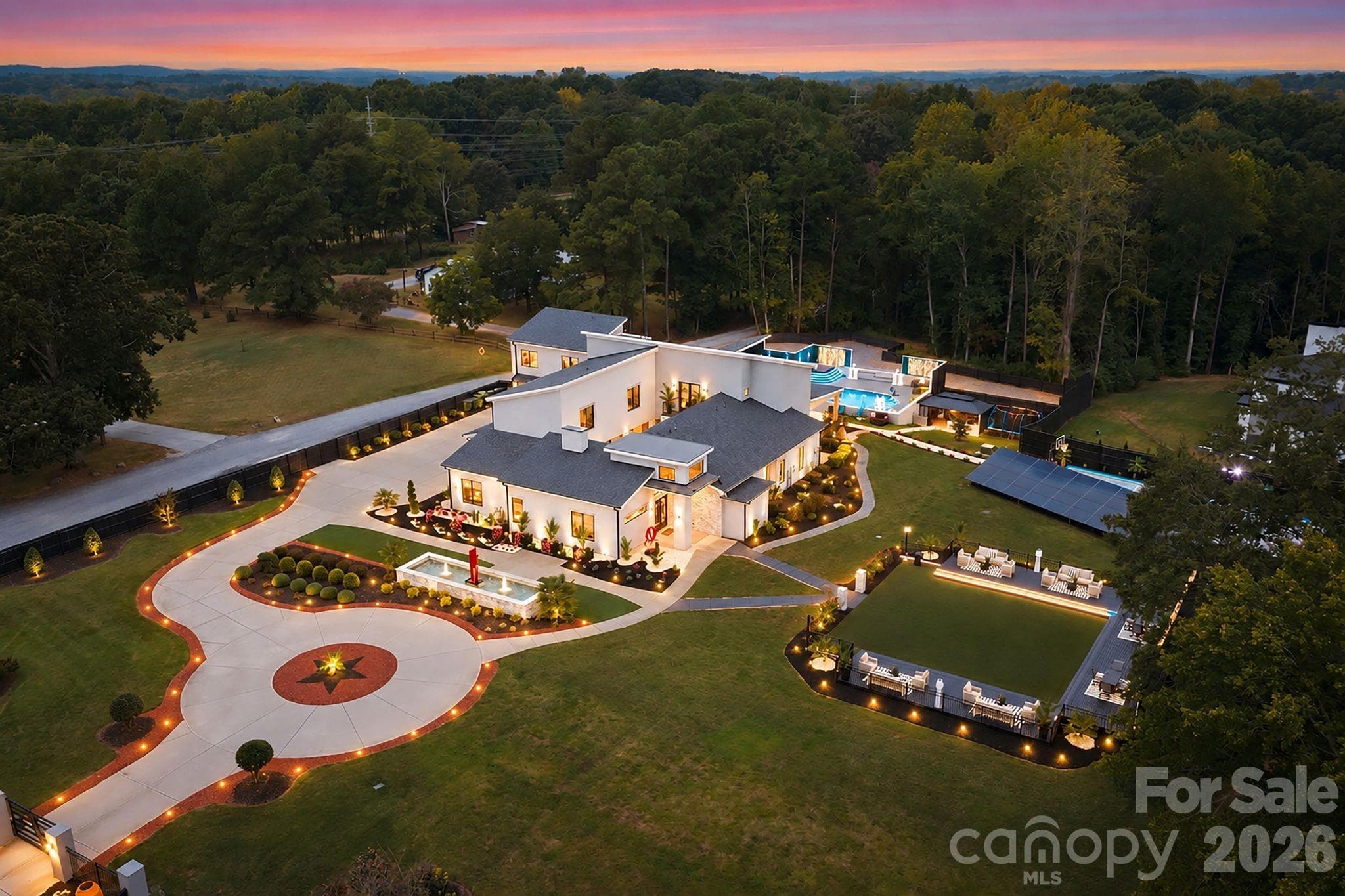 Resort-Style Fountain Courtyard with Luxury front fountain entertainment area featuring. - 15700 Youngblood Road, Charlotte