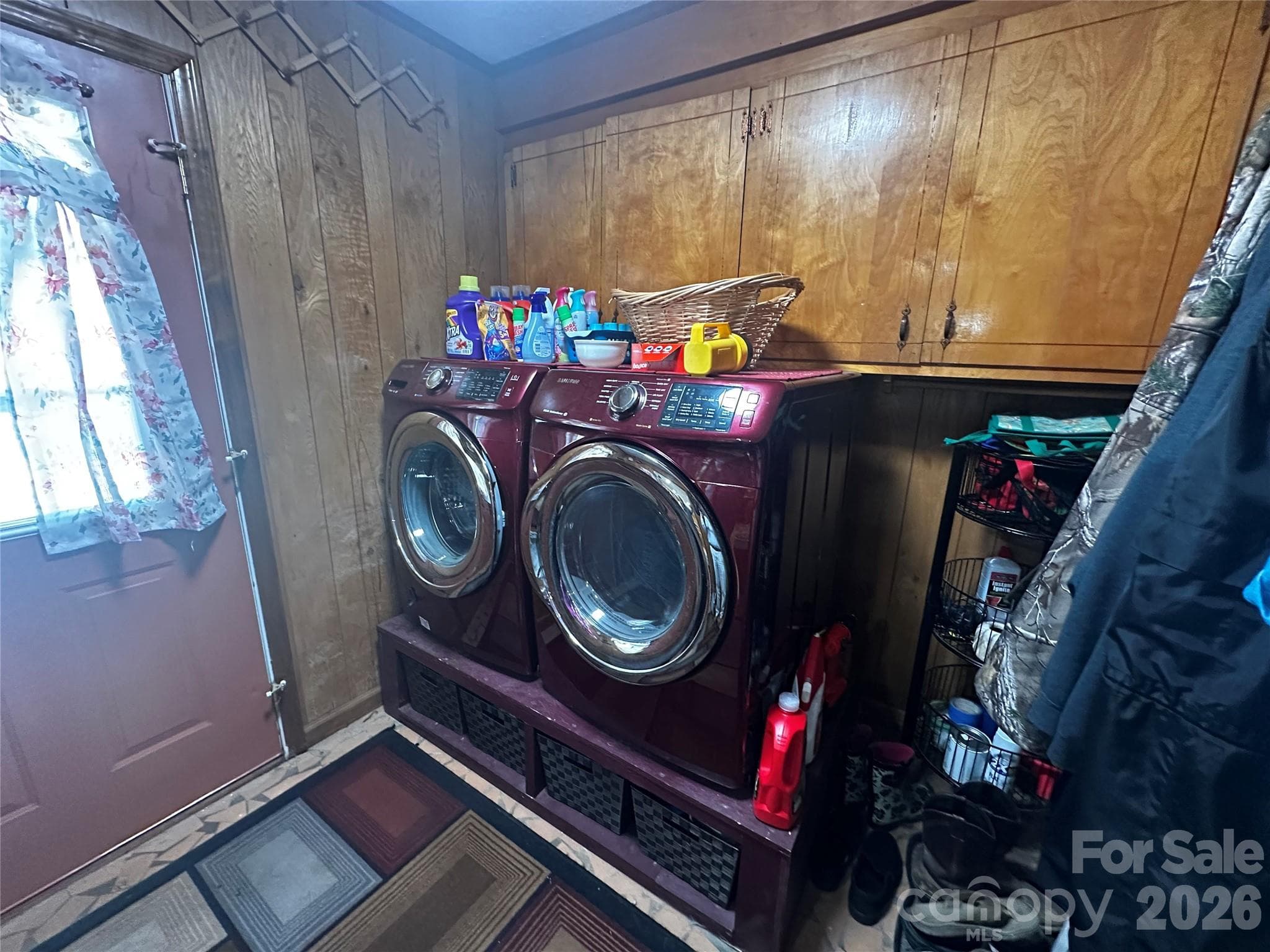 Mud room that includes the washer/dryer and storage, looking towards back door leading to the patio - 1467 Airport Road, Pageland