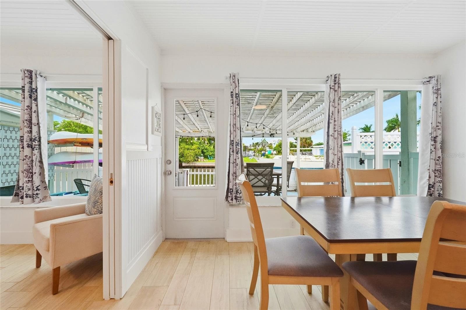 View of the water from owners suite and dining room area - 28 SEASIDE CT, HOLMES BEACH