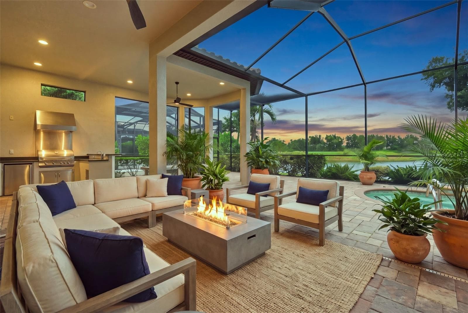 Virtually staged. Furniture and firepit digitally added. - 13309 MALACHITE DR, BRADENTON