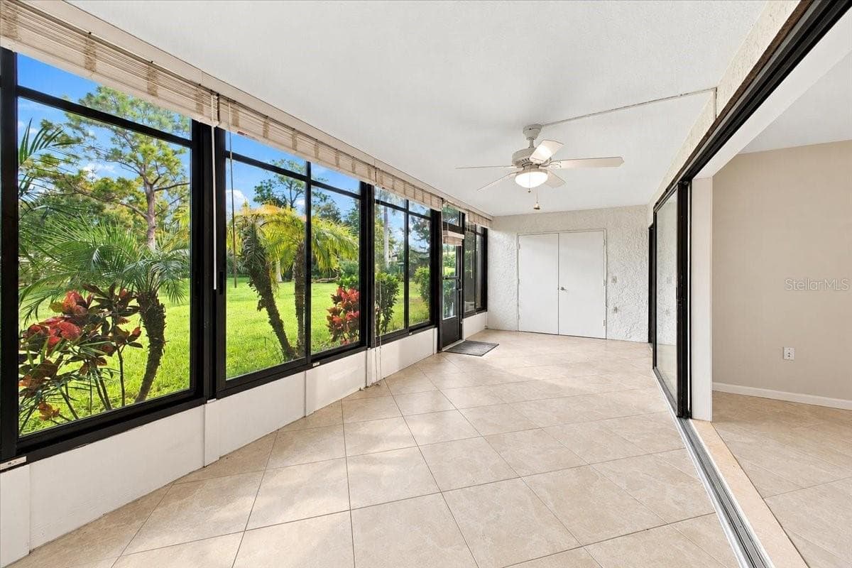 Florida Room with storage off of the living room - 411 PALM TREE DR #411, BRADENTON