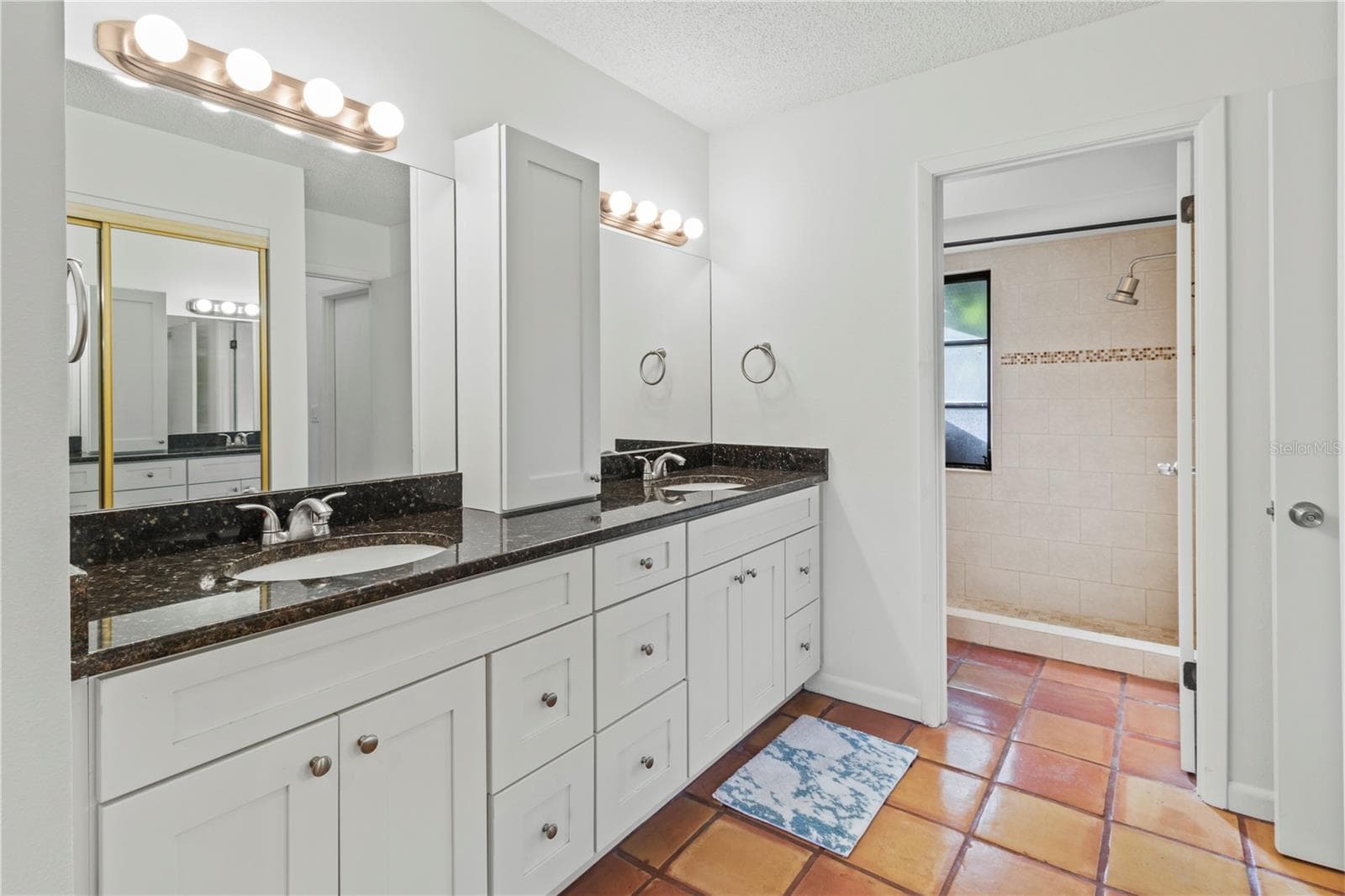primary bathroom with dual sinks - 2375 LAKESIDE MEWS #D2, SARASOTA