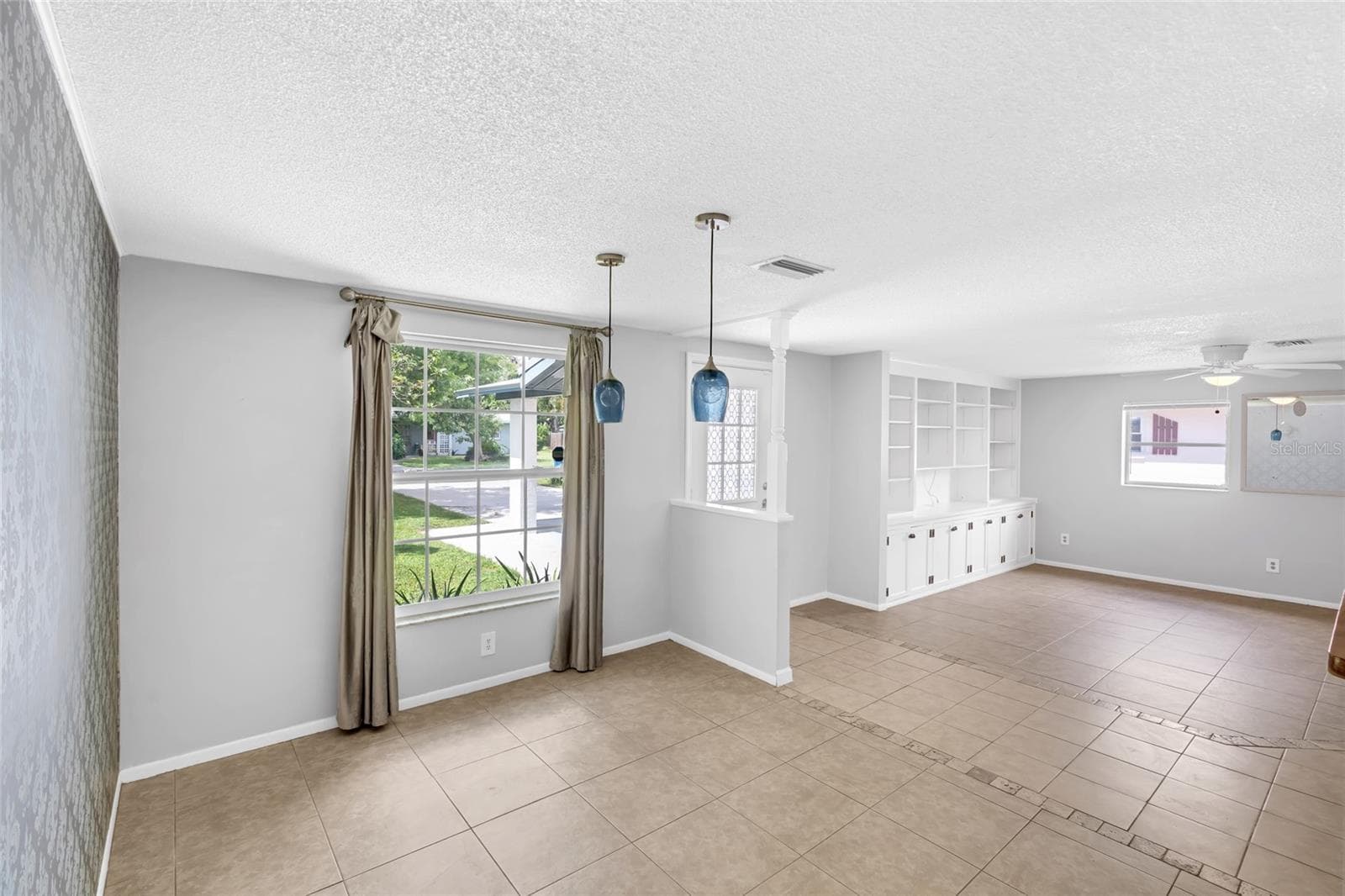 Natural light fills the dining area, with the front entry and main living room just steps away. - 142 2ND AVE, NOKOMIS