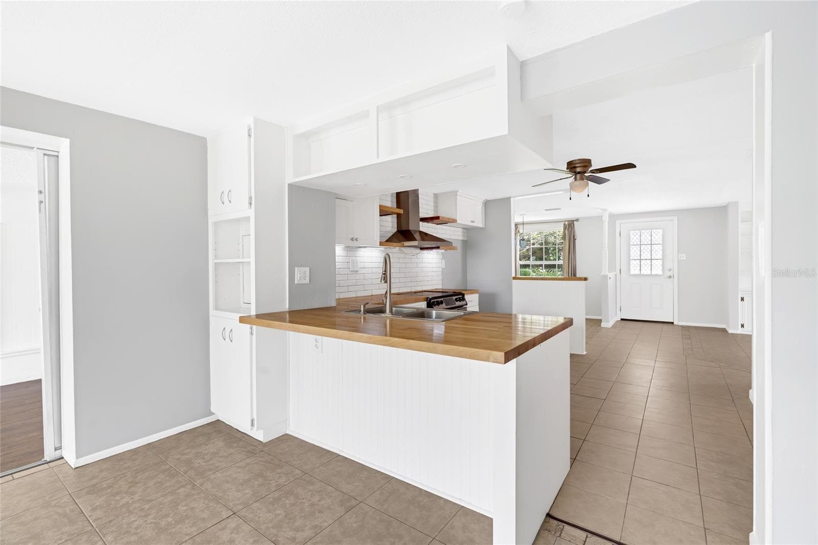 The peninsula adds casual seating, extra prep space and a natural gathering spot at the heart of the home. - 142 2ND AVE, NOKOMIS