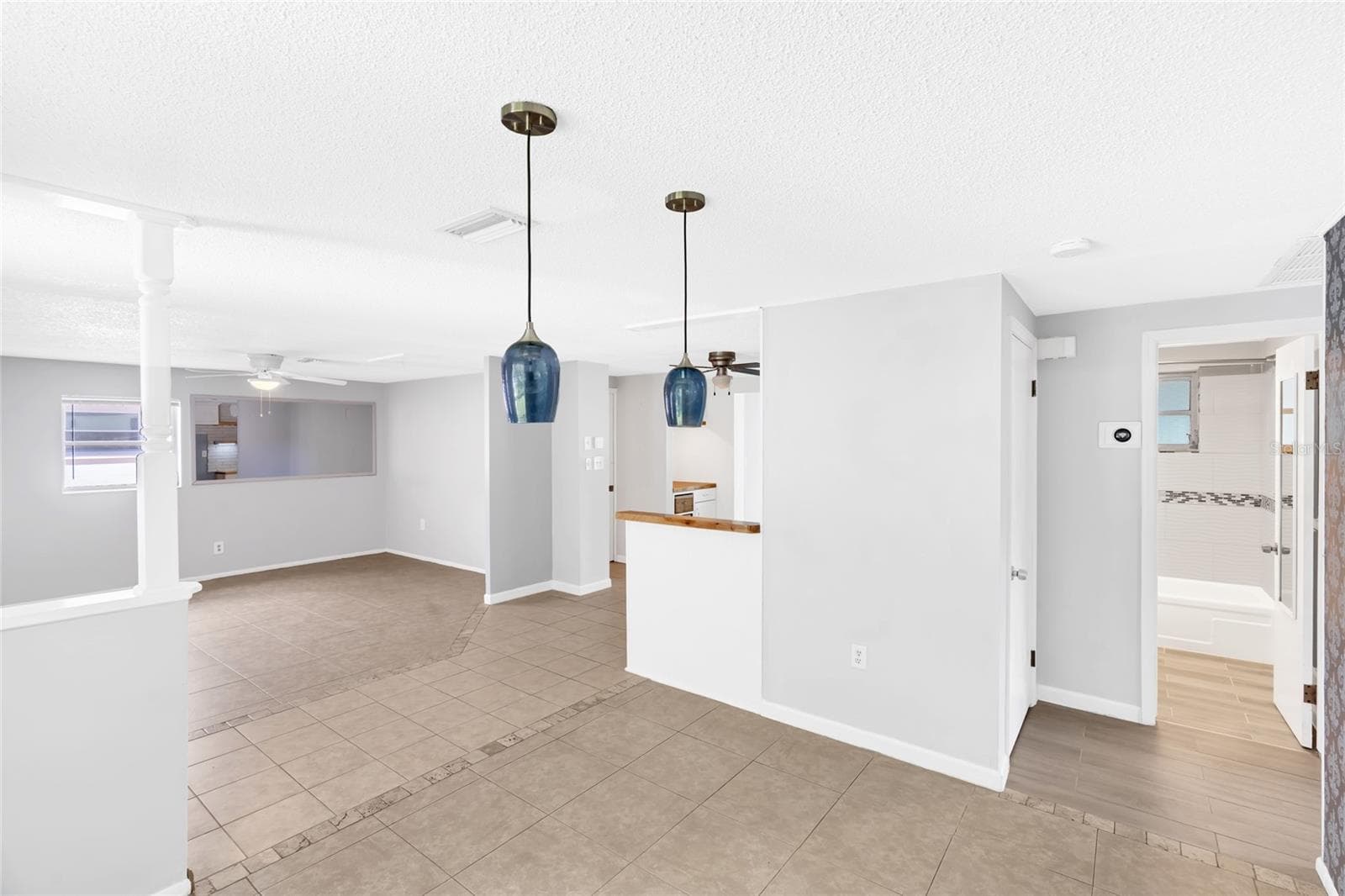 Natural light fills the dining area, with the front entry and main living room just steps away. - 142 2ND AVE, NOKOMIS