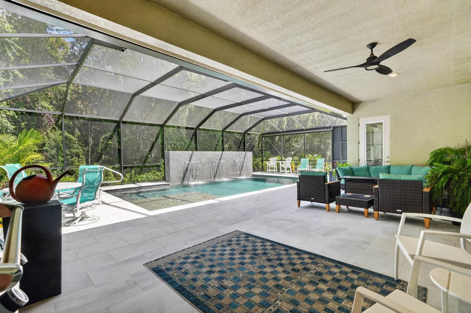 Large covered lanai overlooks stunning pool - 36 NEW WATER OAK DR, PALM COAST
