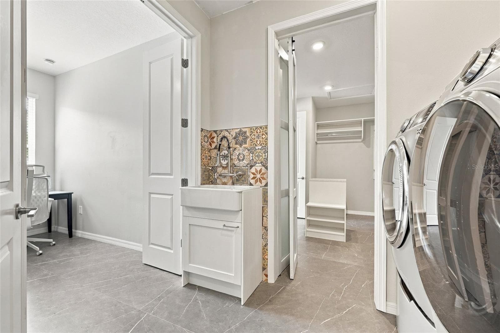 Laundry Room with entrances pathway to Bedroom 2, Walk-in Closet and Hall. - 1801 GOBLET COVE ST, KISSIMMEE