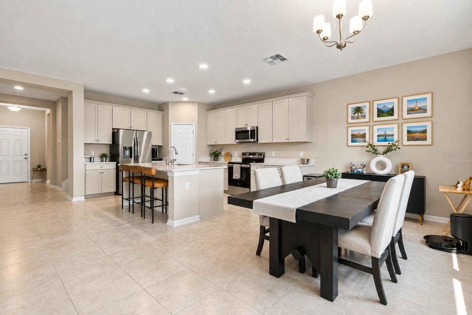 Photos virtually Staged Integrated entertainment with living, dining, and kitchen - 31840 SAPNA CHIME DR, WESLEY CHAPEL