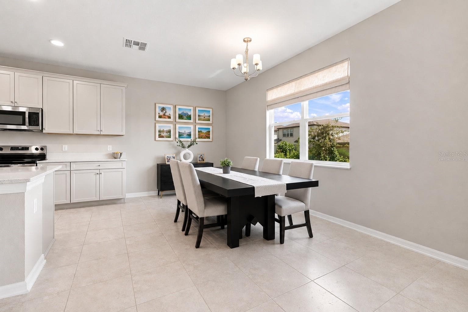 Photos virtually Staged Large windows let in the sunlight. - 31840 SAPNA CHIME DR, WESLEY CHAPEL
