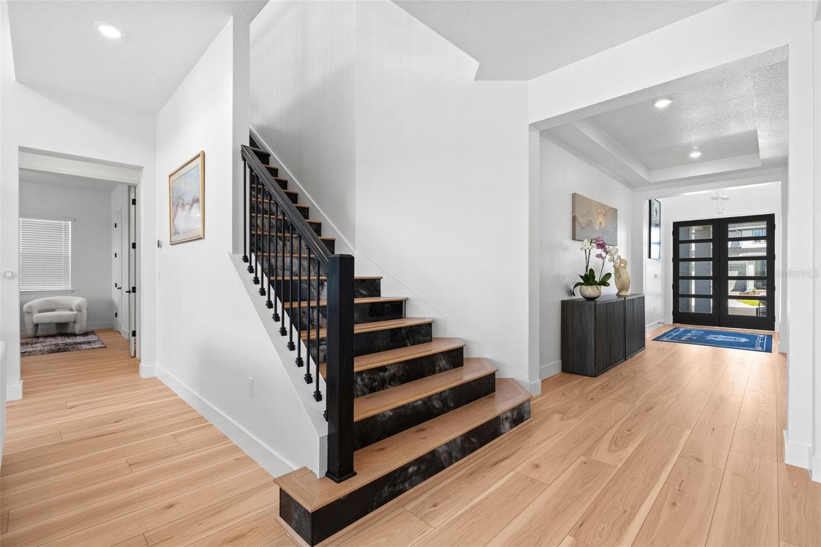 Beautiful staircase perfectly complements the front entry. - 4617 GOLDEN BIRCH AVE, CLERMONT