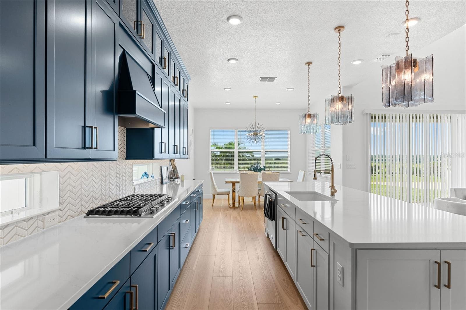 Kitchen is open to a casual dining space and the generous living room. - 4617 GOLDEN BIRCH AVE, CLERMONT