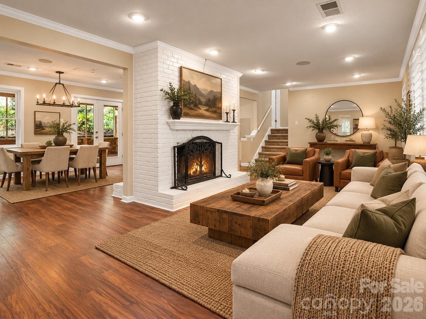 Beautiful double sided gas log fireplace separating the living space from the dining room. AI generated virtual staging. - Black Mountain