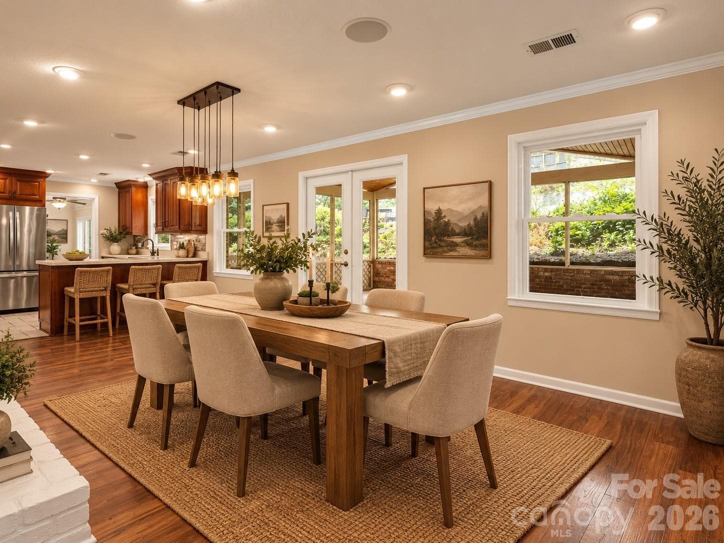 Beautiful dining area open to the kitchen and direct access to the screened back porch. AI generated virtual staging. - Black Mountain