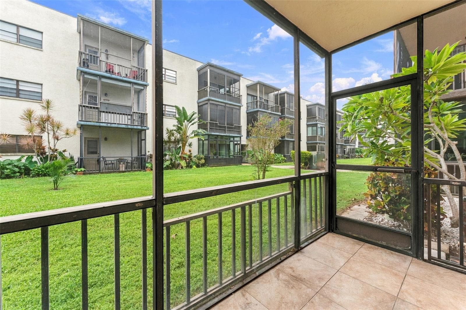 Lovely lanai off of the kitchen, perfect if you have a little pet or nurture some plants or herbs! - 5971 TERRACE PARK DR N #108, ST PETERSBURG