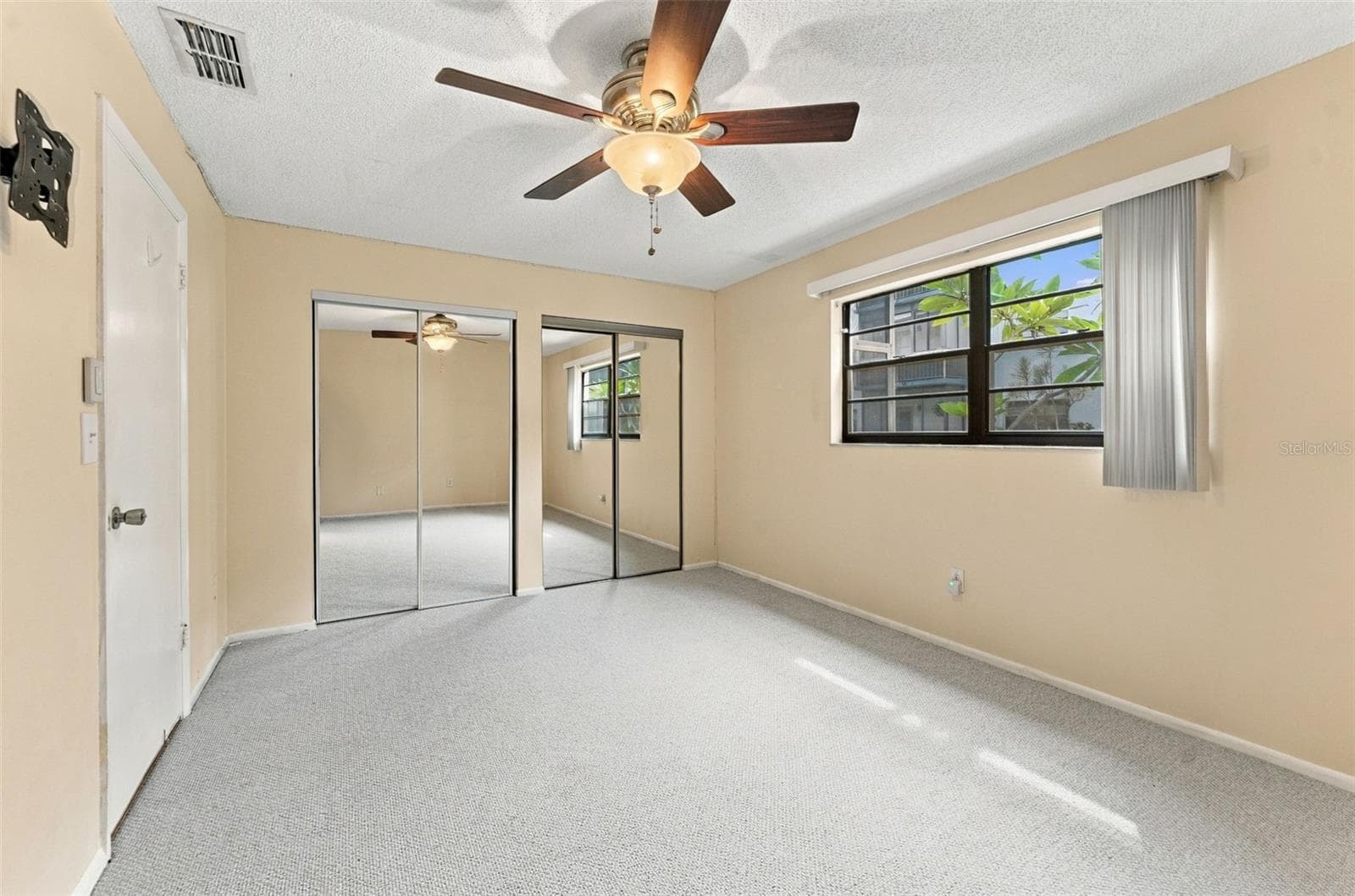 Primary bedroom at the back of the condo - 5971 TERRACE PARK DR N #108, ST PETERSBURG