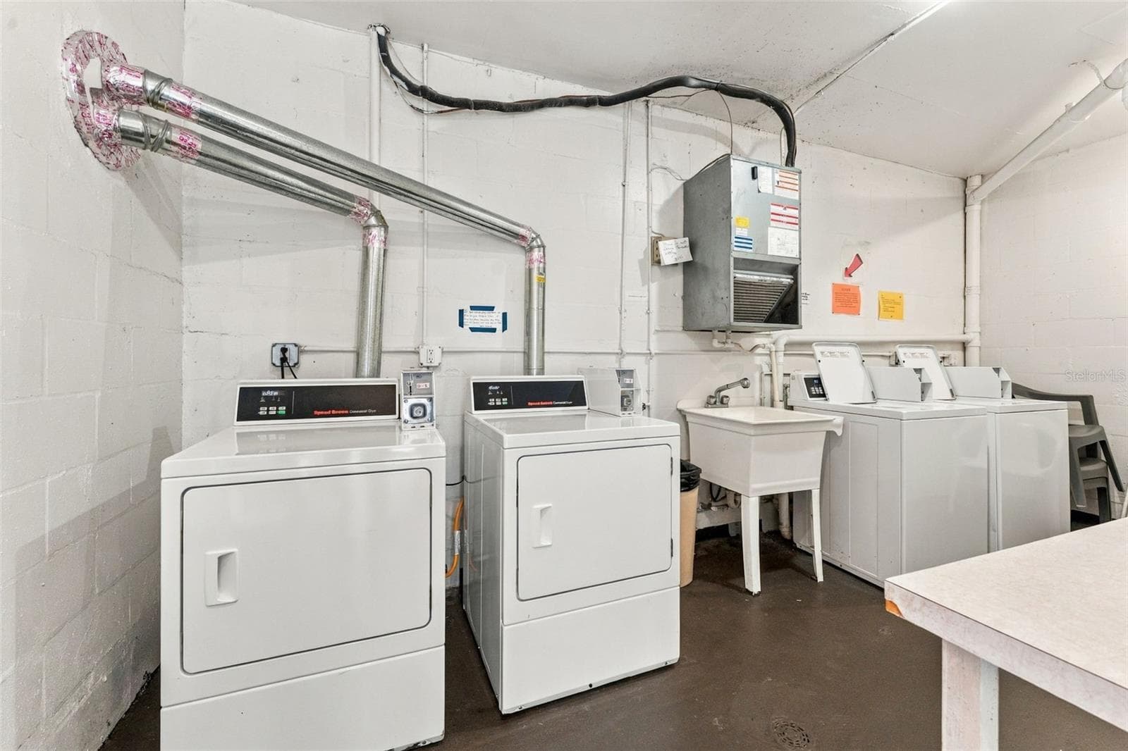 Laundry room on the second floor. Get all of your laundry done at once! - 5971 TERRACE PARK DR N #108, ST PETERSBURG