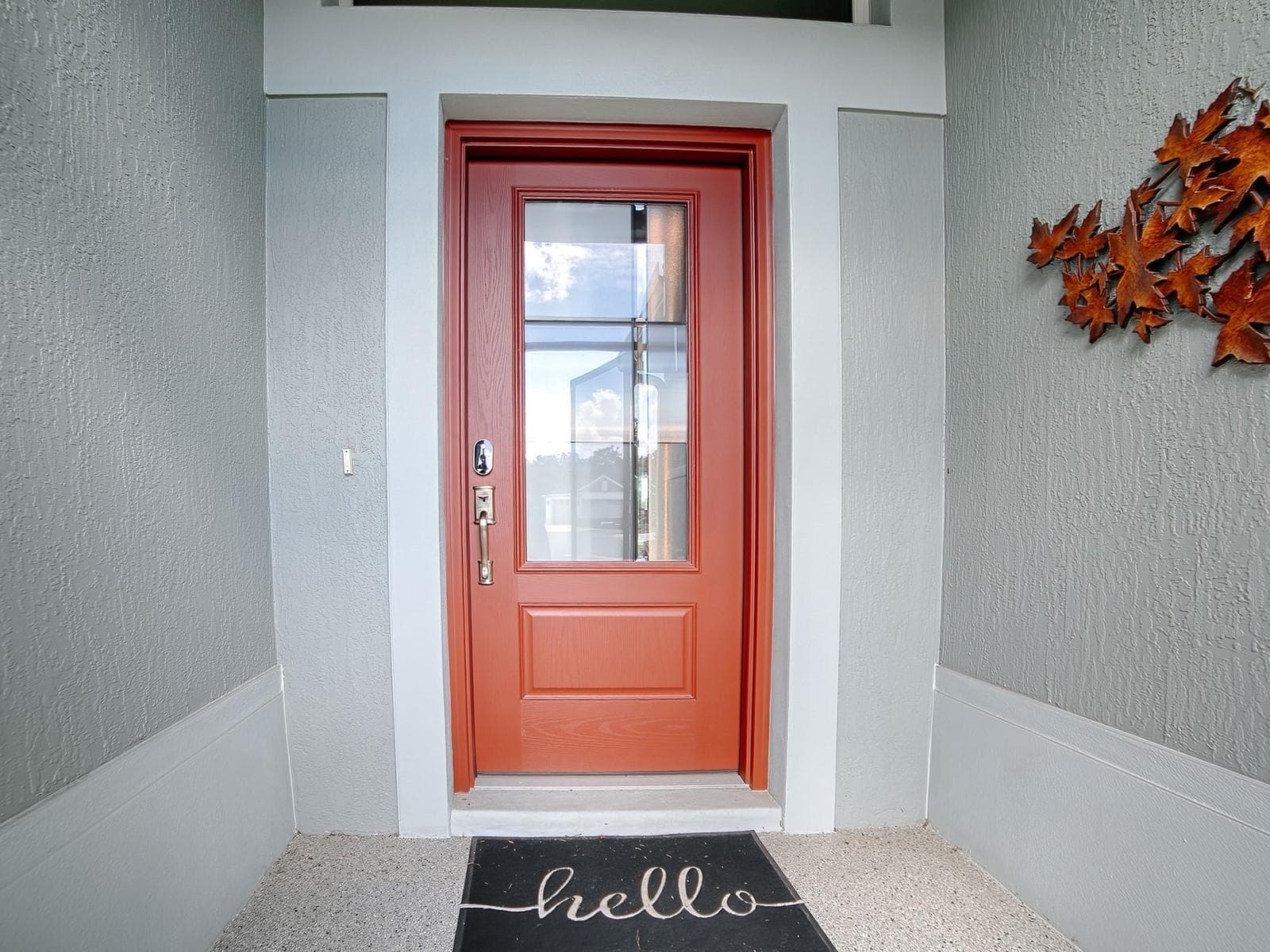 INVITING ENTRANCE WITH A DECORATIVE CONCRETE COATED ENTRANCE AND LEADED GLASS FRONT DOOR. - 3075 LICCIARDELLO PATH, THE VILLAGES