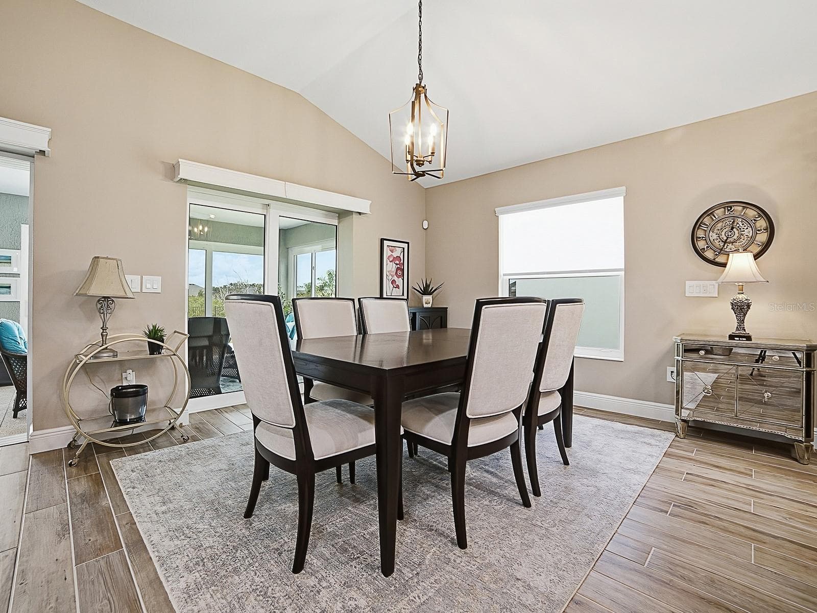 LIGHT AND BRIGHT WITH THE LARGE WINDOW AND STACKBACK SLIDING GLASS DOORS THAT OPEN TO THE FLORIDA ROOM OFFERING A GREAT VIEW OF THE PRESERVE. - 3075 LICCIARDELLO PATH, THE VILLAGES