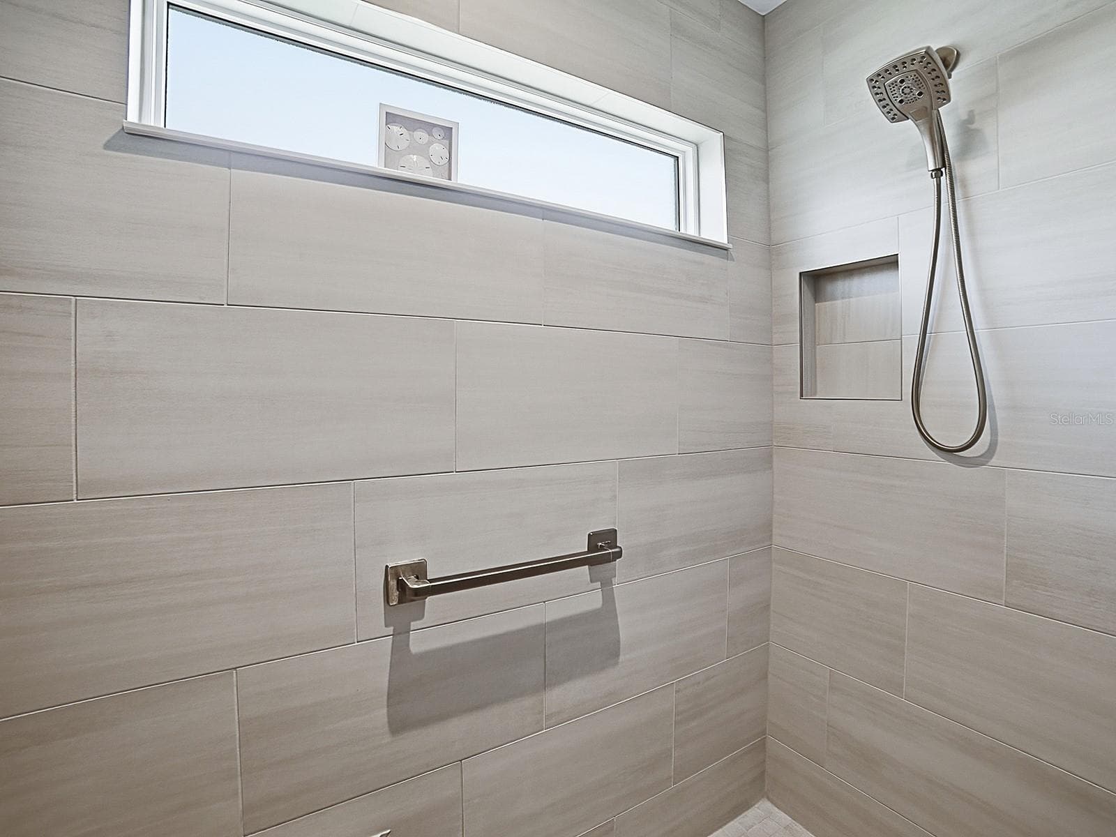 LOVELY TILED SHOWER WITH A WINDOW. - 3075 LICCIARDELLO PATH, THE VILLAGES
