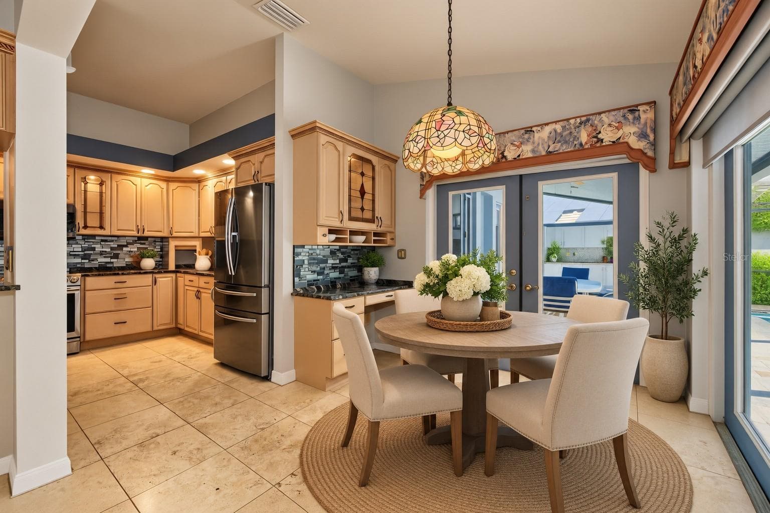 staged kitchen and eat in area - 2233 PINNACLE CIR S, PALM HARBOR