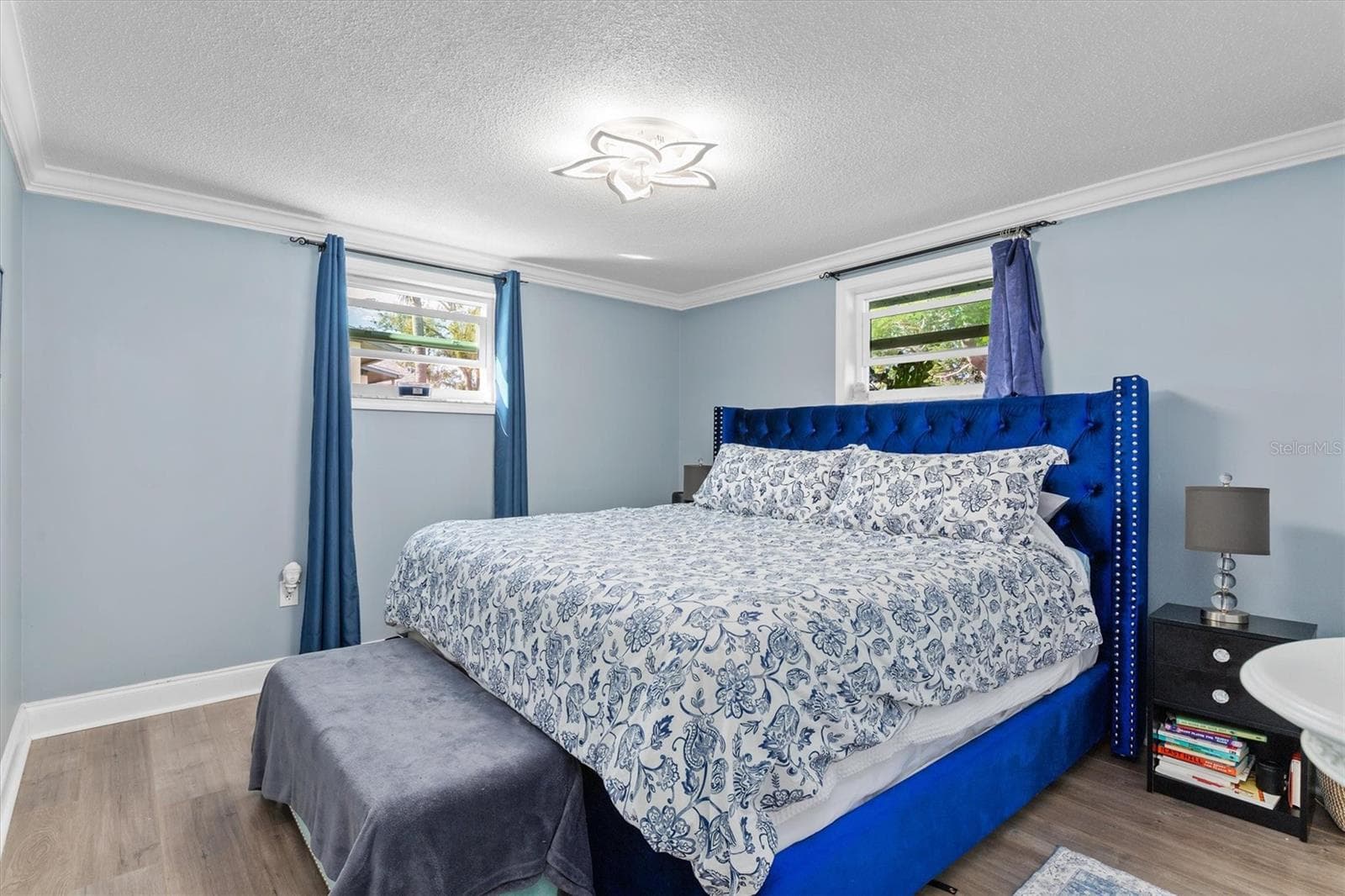 Bedroom 2 easily accommodates a King bed and additional furniture, giving guests a true bedroom rather than a space that feels like an afterthought. Photo taken during prior occupancy. - 142 2ND AVE, NOKOMIS