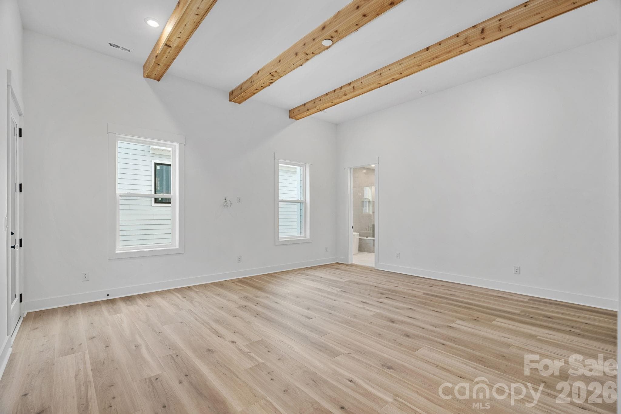 Primary Suite with 12-foot ceilings and access to deck. - 4477 Splash Trail, Sherrills Ford