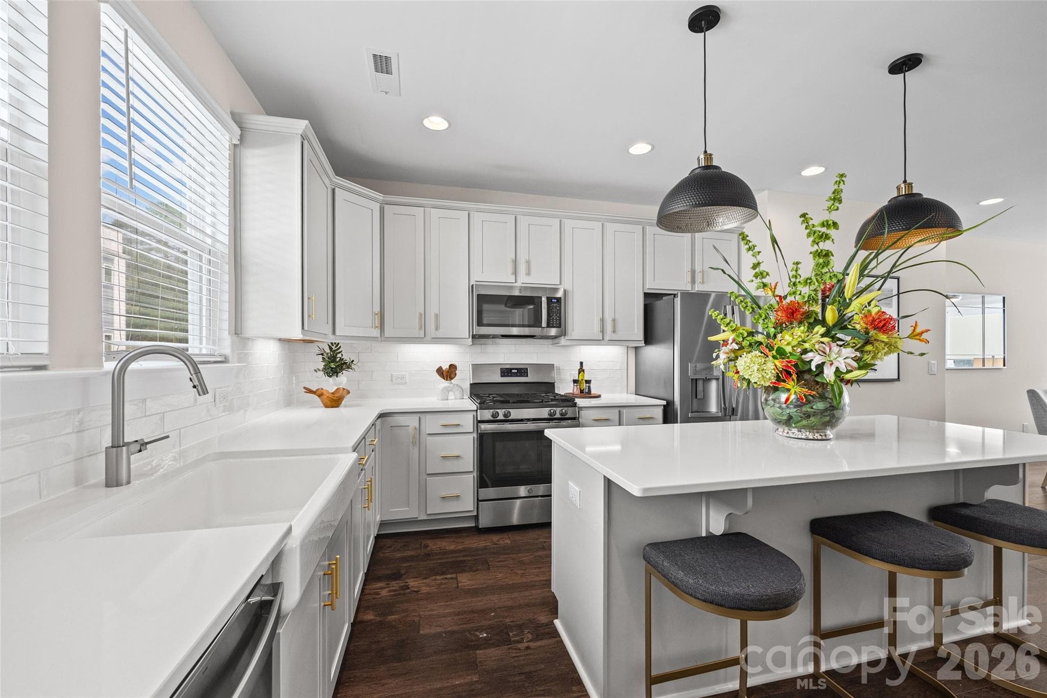 2nd FL: Bright kitchen with a spacious island, pendant lighting and pantry - 1229 Lomax Avenue, Charlotte