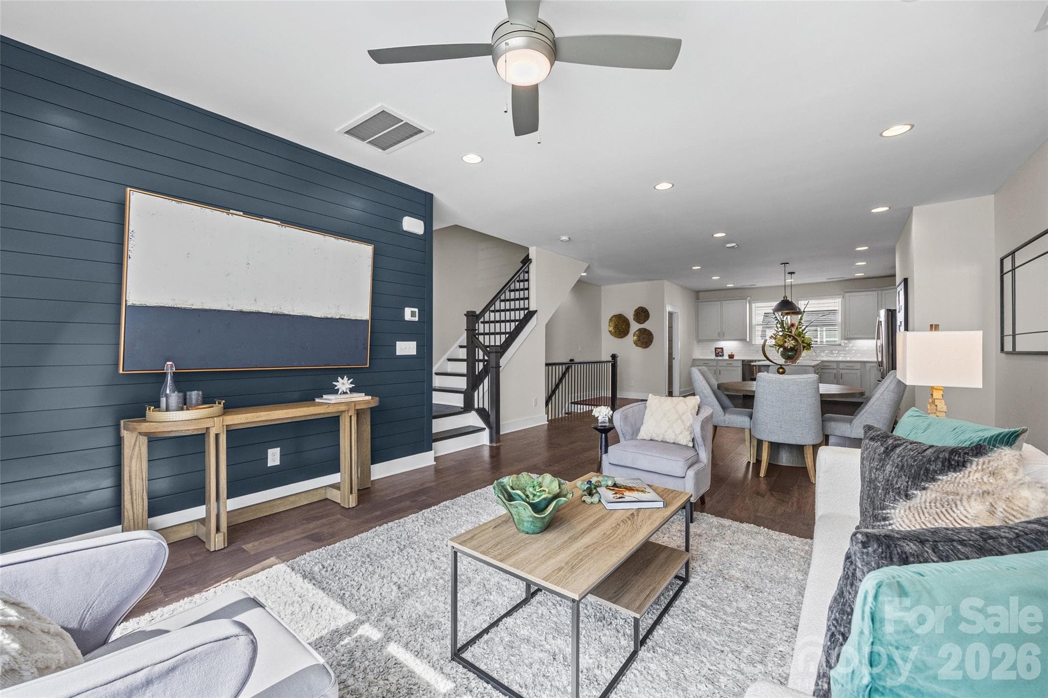 2nd FL: Spacious living and dining area with a striking blue accent wall - 1229 Lomax Avenue, Charlotte