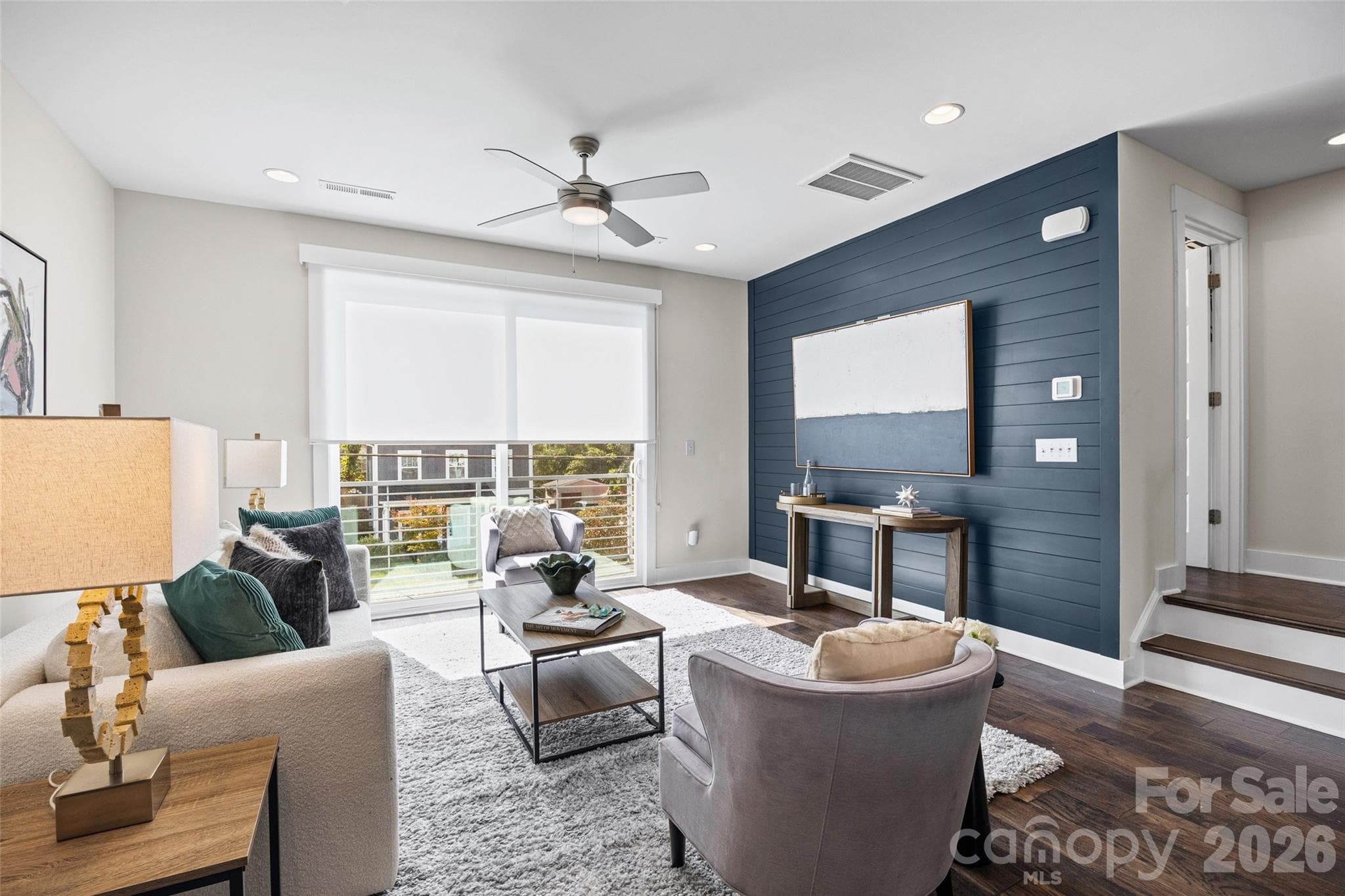 2nd: Light-filled living room with custom wall detailing - 1229 Lomax Avenue, Charlotte
