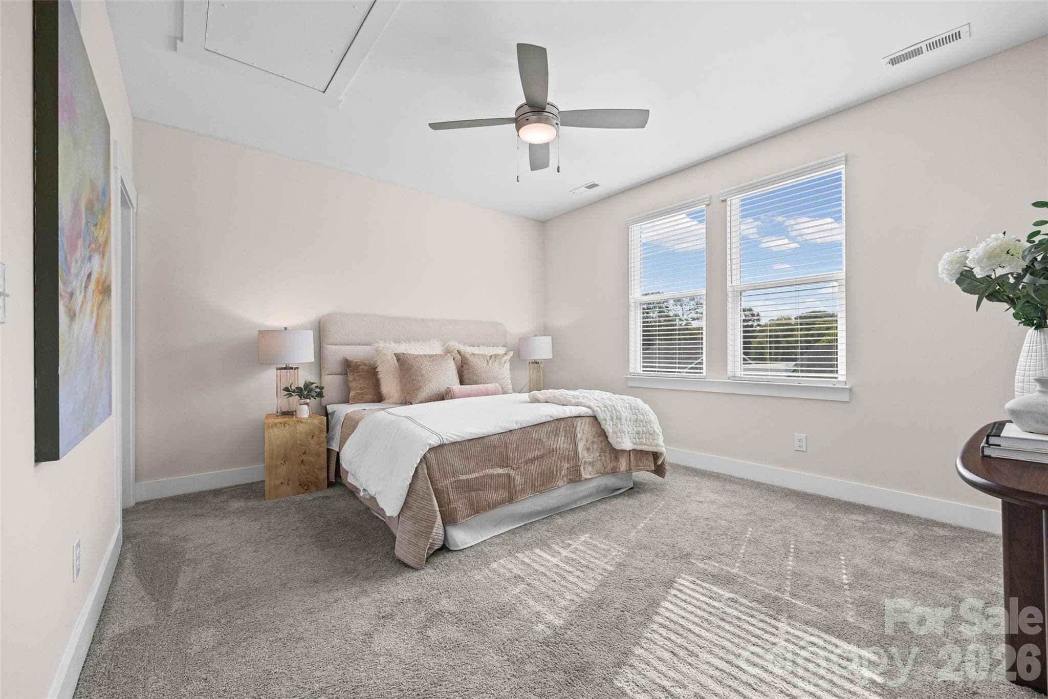 3rd FL: Primary Bedroom with natural light, ceiling fan, en-suite bath and walk in closet - 1229 Lomax Avenue, Charlotte