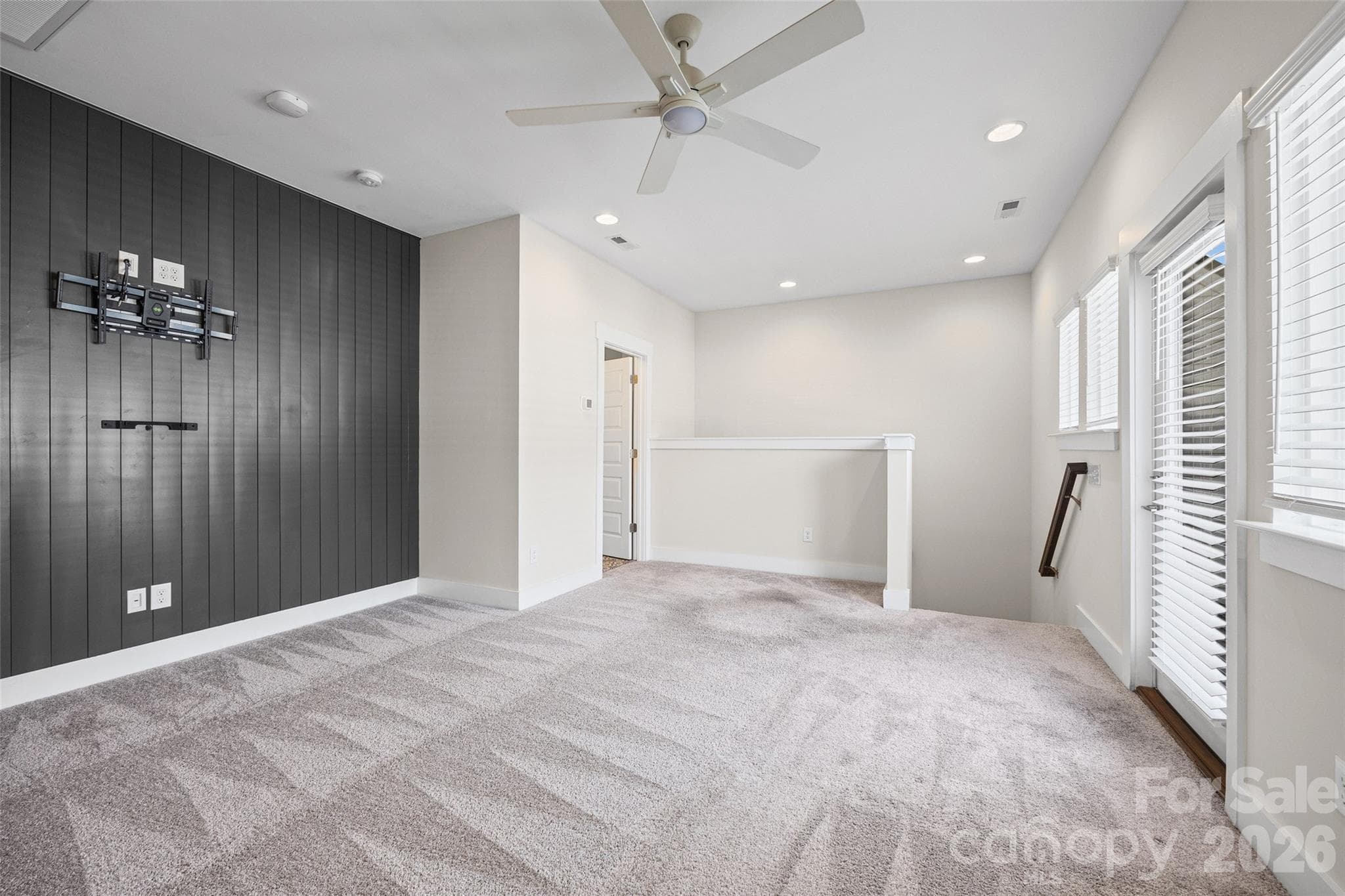 4th FL: Flex room with a dark paneled accent wall and rooftop access - 1229 Lomax Avenue, Charlotte