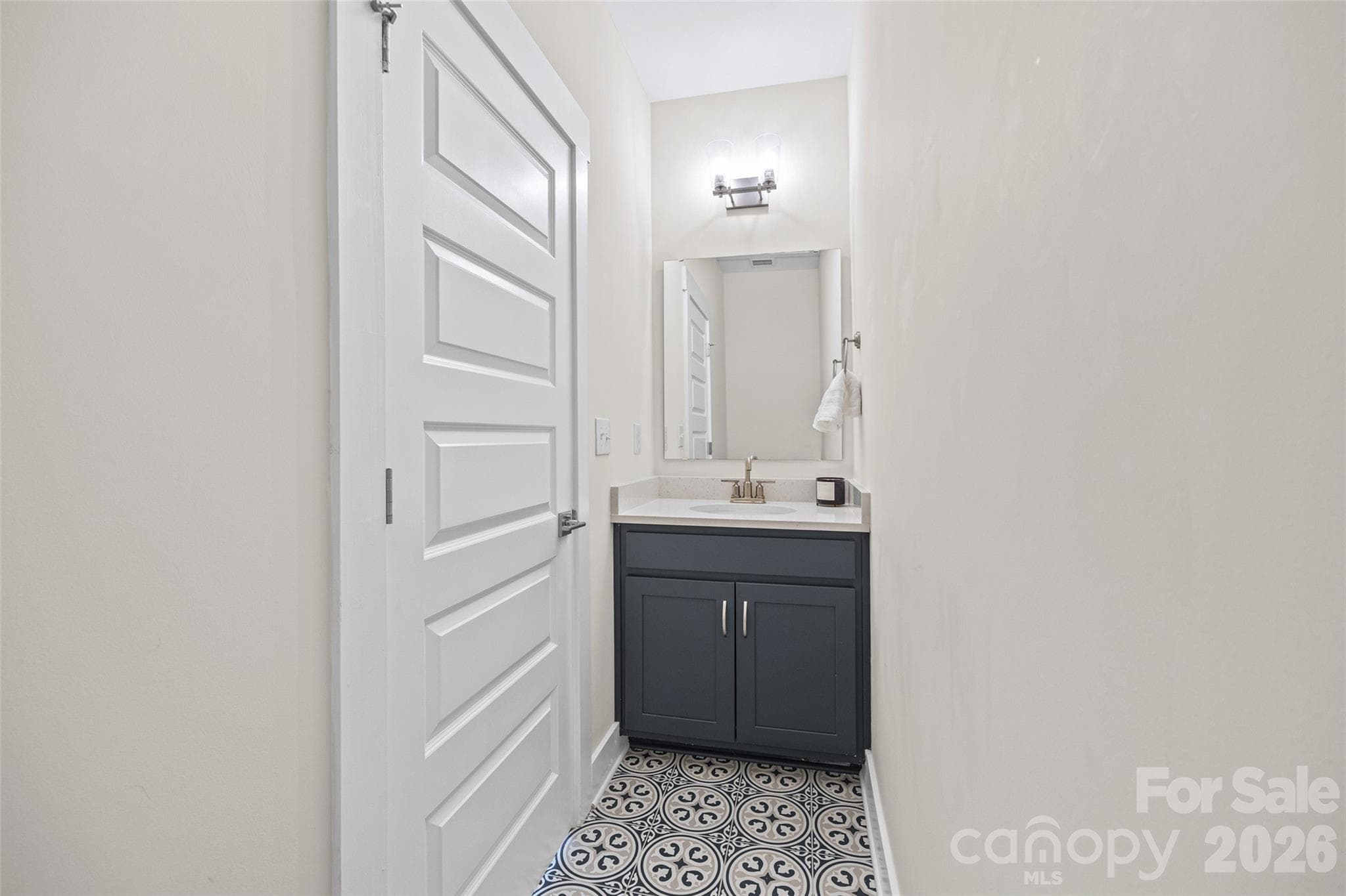 Flex-room 4th floor powder room with patterned tile - 1229 Lomax Avenue, Charlotte