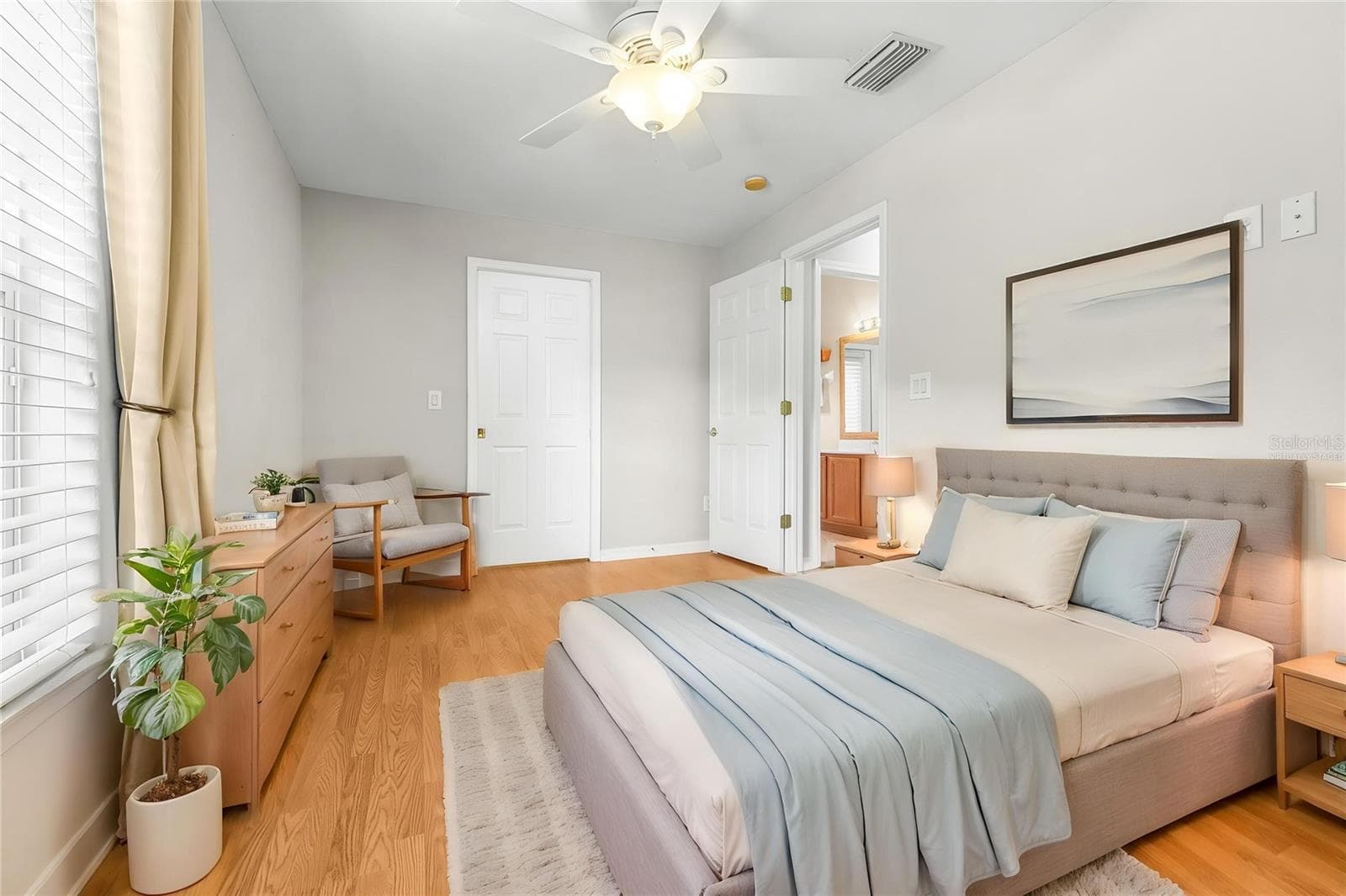 Virtually staged first floor bedroom with ensuite bath - 27015 FIREBUSH DR, WESLEY CHAPEL