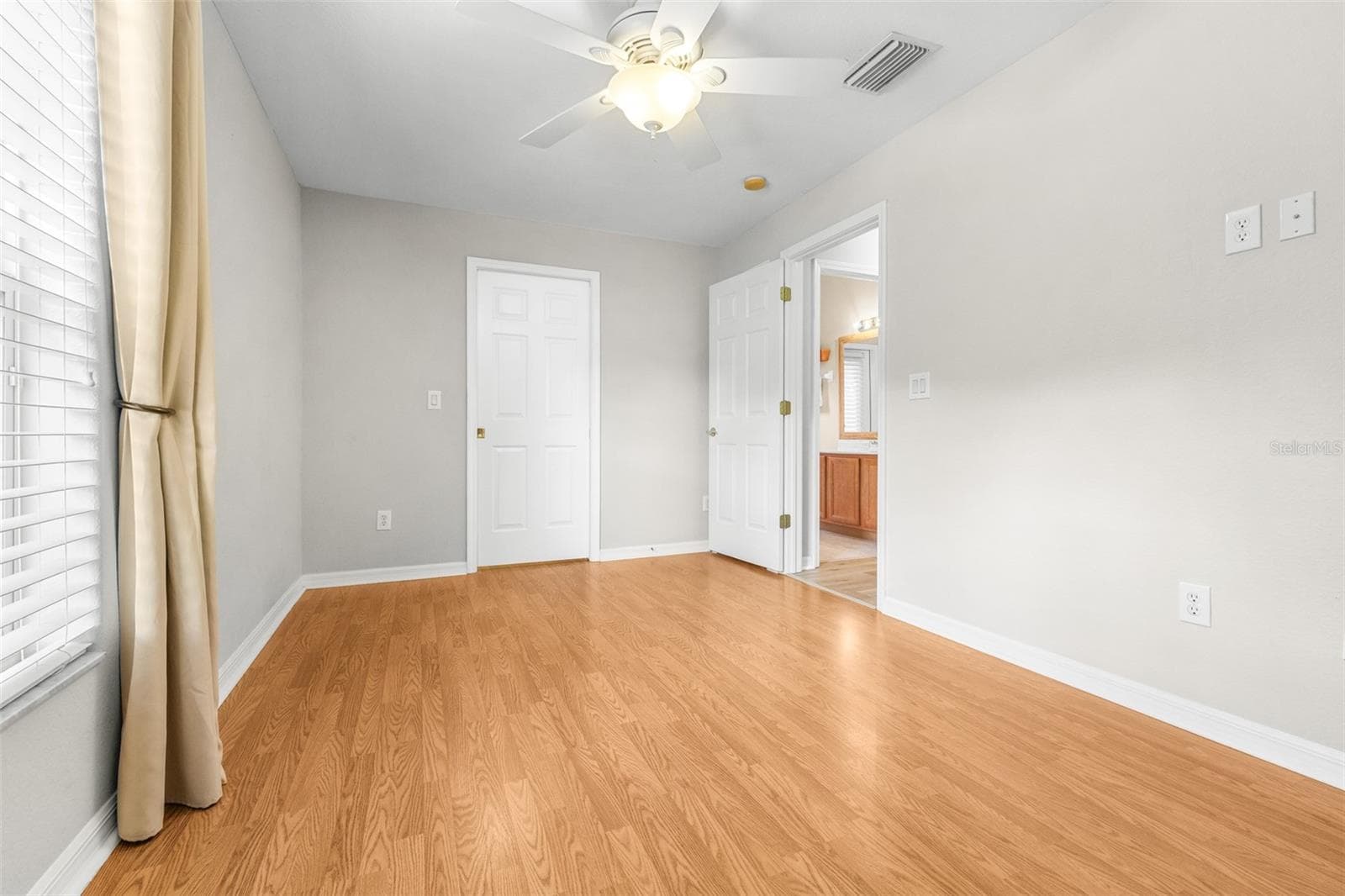 First floor bedroom with ensuite bath - 27015 FIREBUSH DR, WESLEY CHAPEL