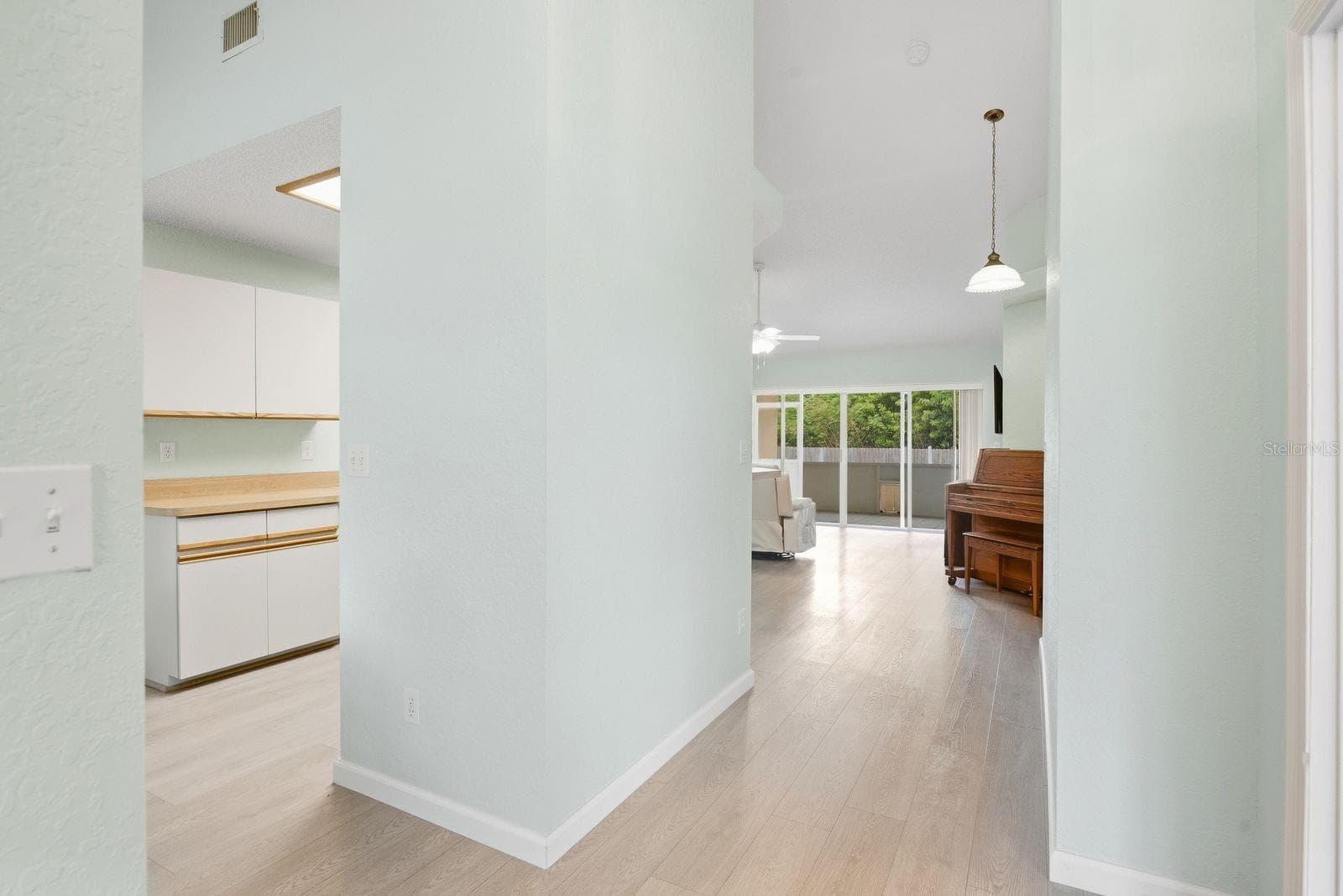 Easy flow from the hallway into the living spaces. - 5955 107TH TER N, PINELLAS PARK
