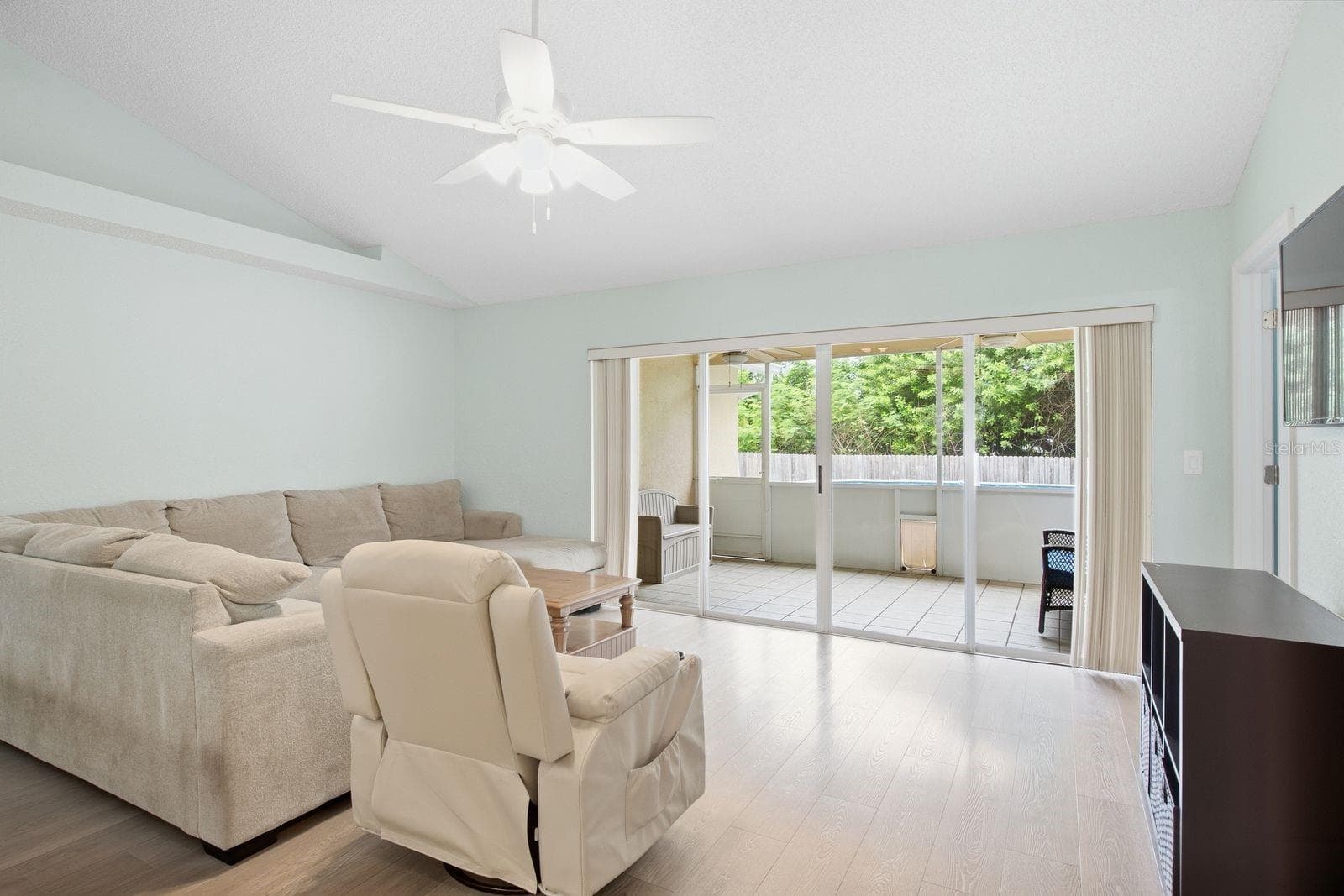 Sunlit living room with a lovely view outdoors. - 5955 107TH TER N, PINELLAS PARK