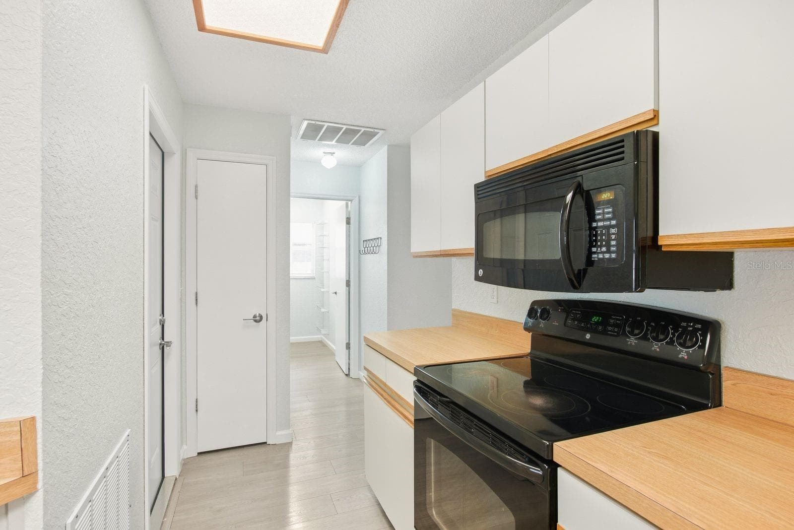A spacious kitchen layout with generous counter space. - 5955 107TH TER N, PINELLAS PARK