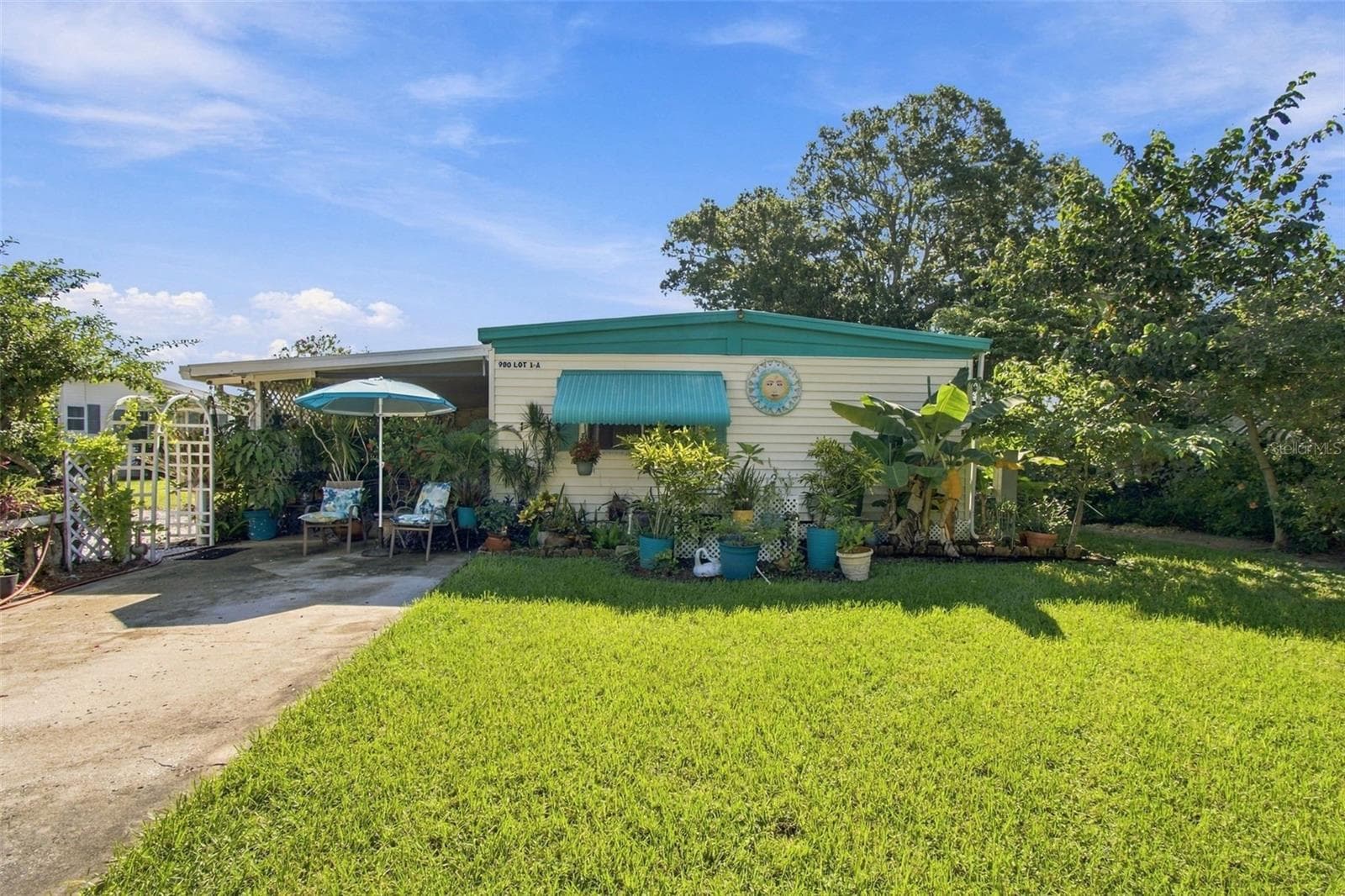 Front exposure  of this Tropical Lakeside OASIS - 980 7TH ST NW #1A, LARGO