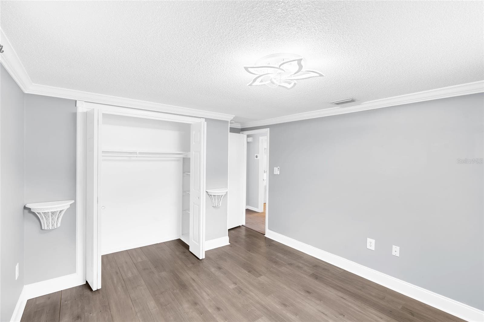 Bedroom 2 also offers a wide closet and excellent wall space, adding useful storage without sacrificing the size of the room. - 142 2ND AVE, NOKOMIS
