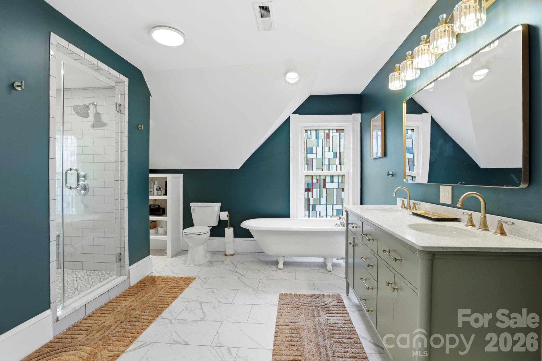 Updated Primary bathroom with original claw foot tub - 60 Roberts Street, Asheville