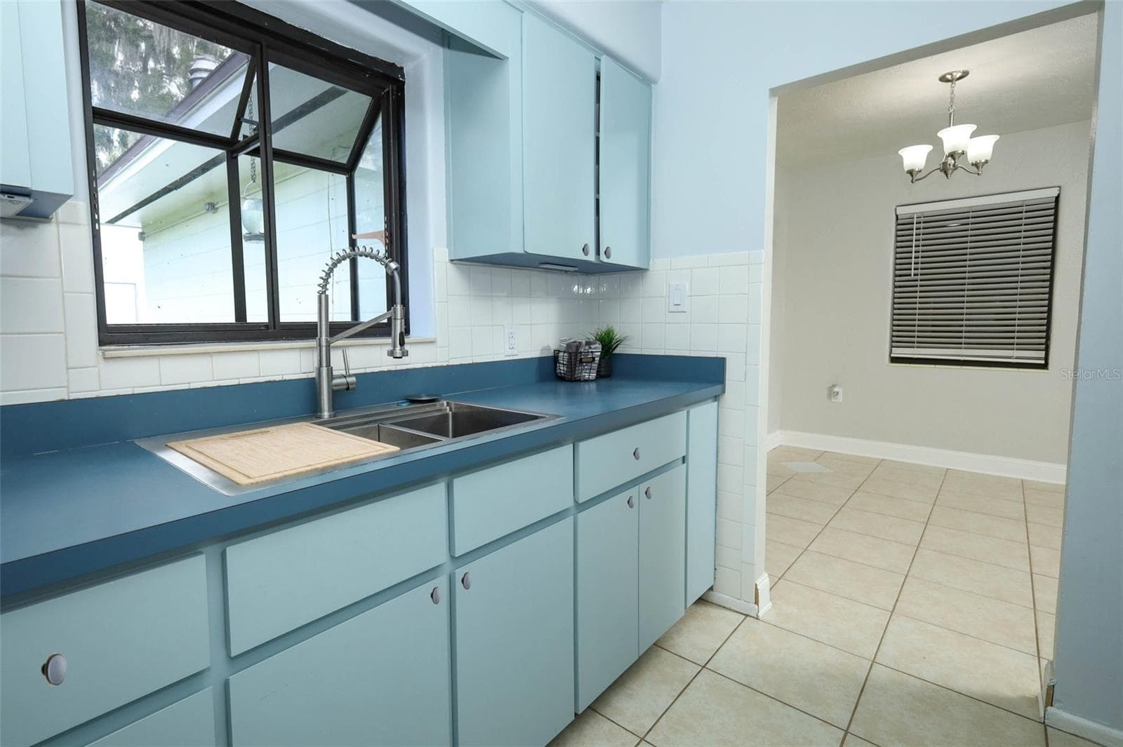 Kitchen with Window Box and Dining Room - 506 S ELSASSER ST, DELAND