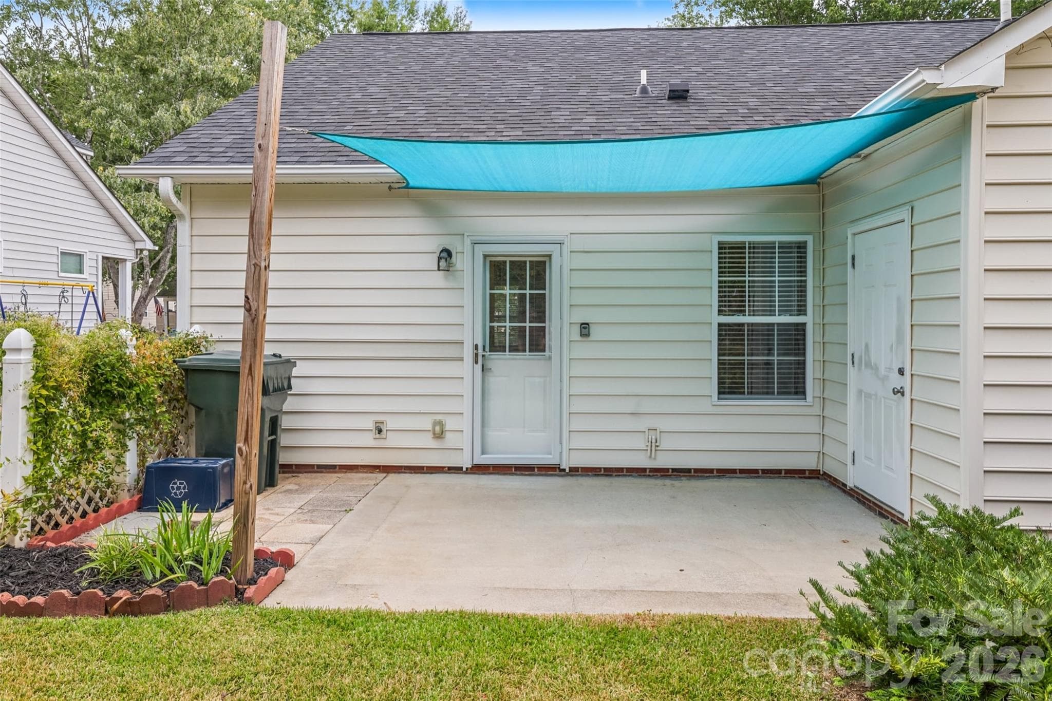 private patio - sun shade installed - 1720 Clemmon Sanders Circle, Rock Hill