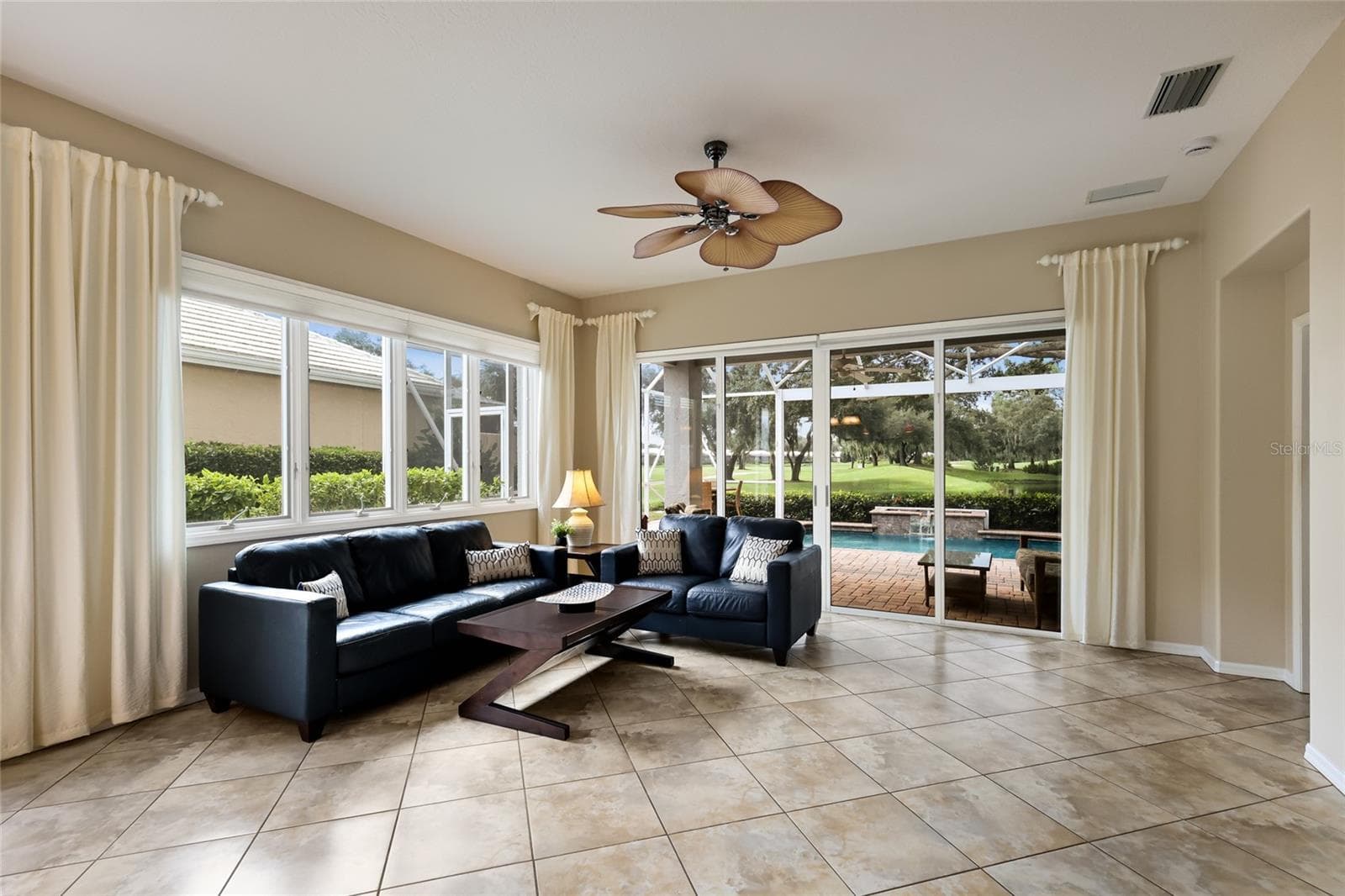 Spacious living room with views of the course - 8728 52ND DR E, BRADENTON