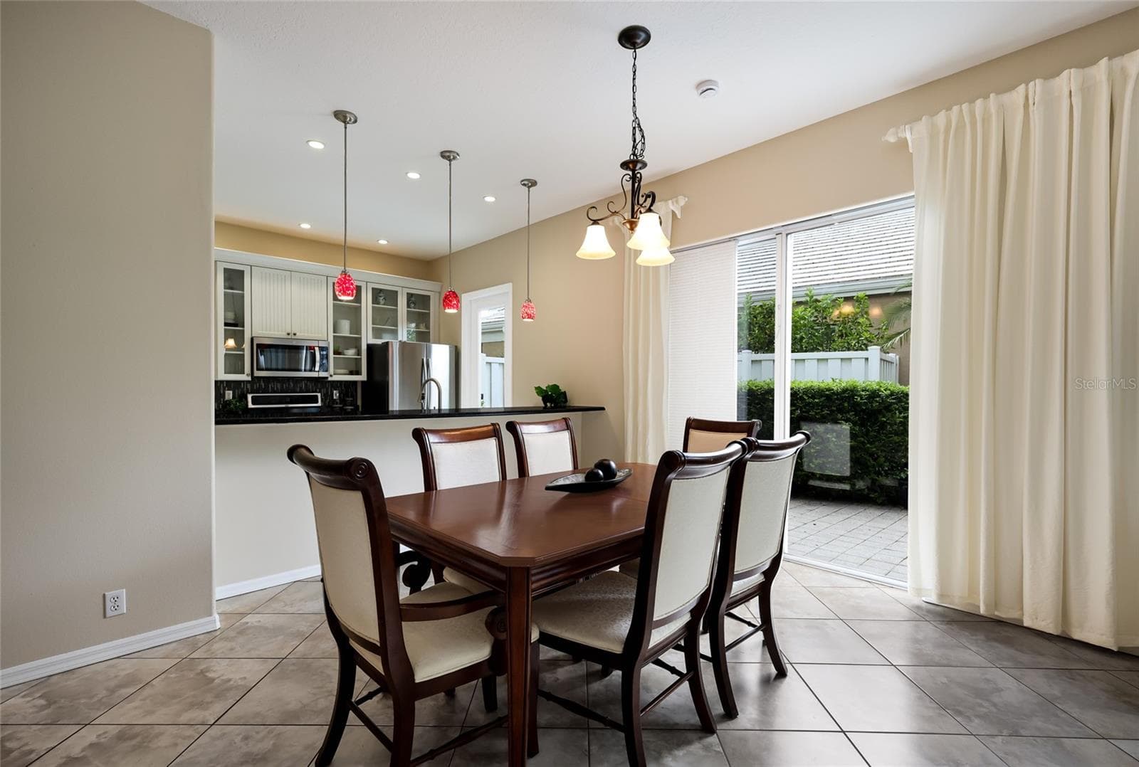 Large dinging space with access out to the side patio - 8728 52ND DR E, BRADENTON