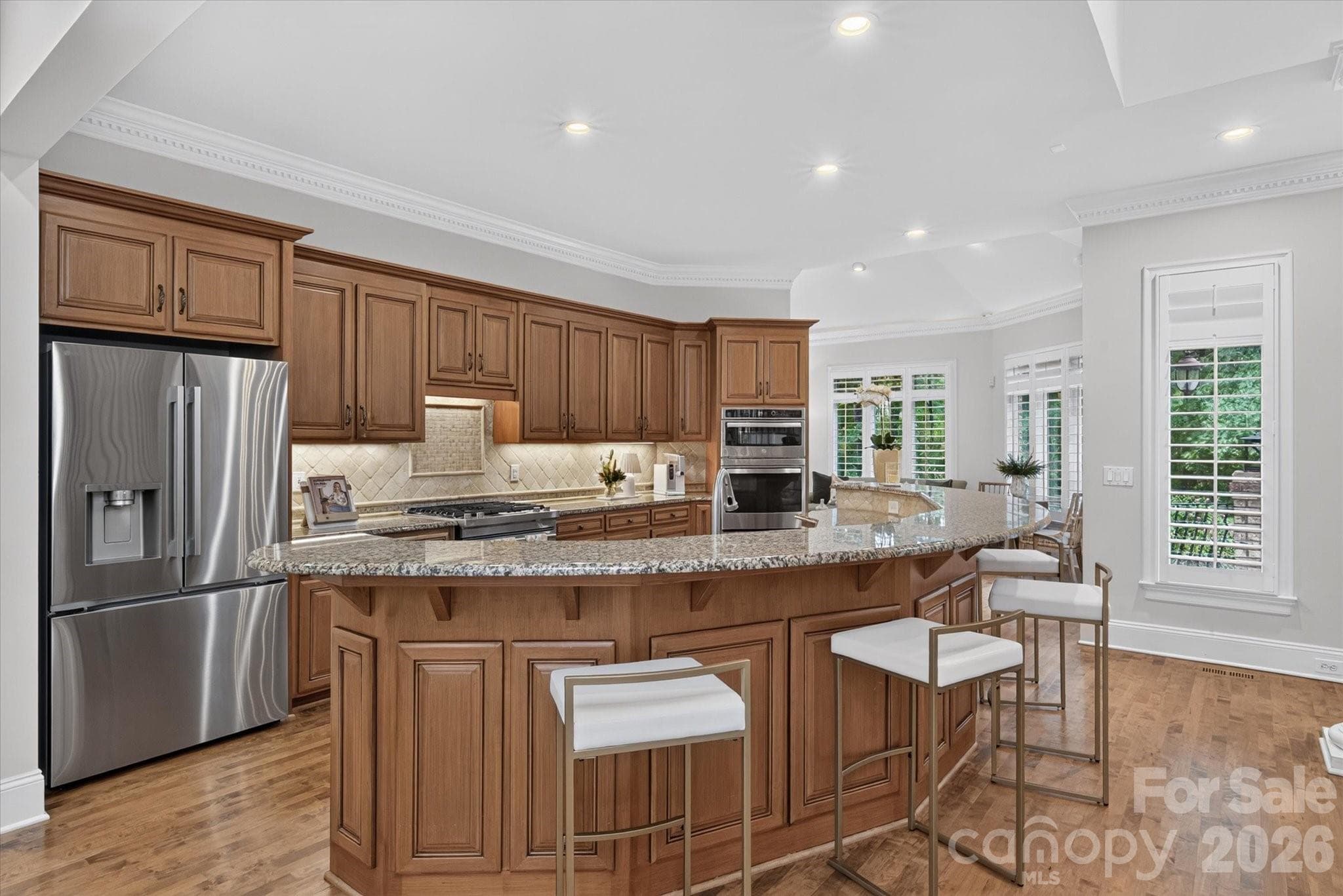 Expansive island with plenty of seating - 1005 Firethorne Club Drive, Marvin