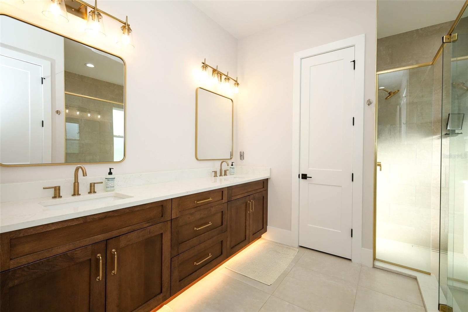 Spa like owners bathroom with under cabinet lighting, large linen closet and private water closet - 175 PINE ST, GENEVA