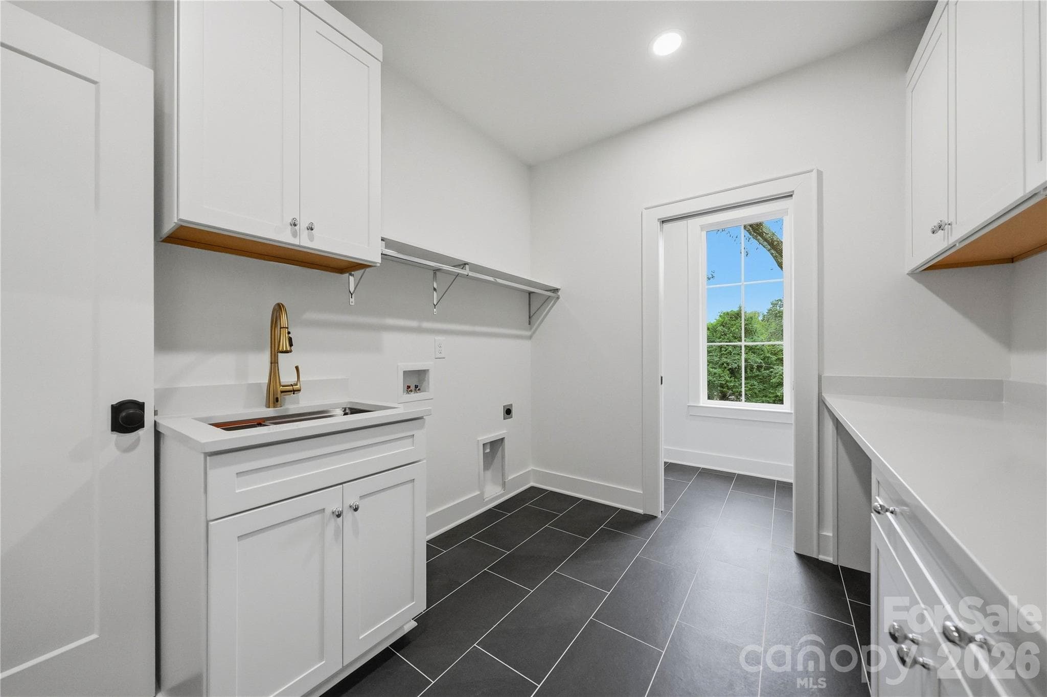Laundry room (accessed via primary suite & upper level hallway) - 1115 Lomax Avenue, Charlotte